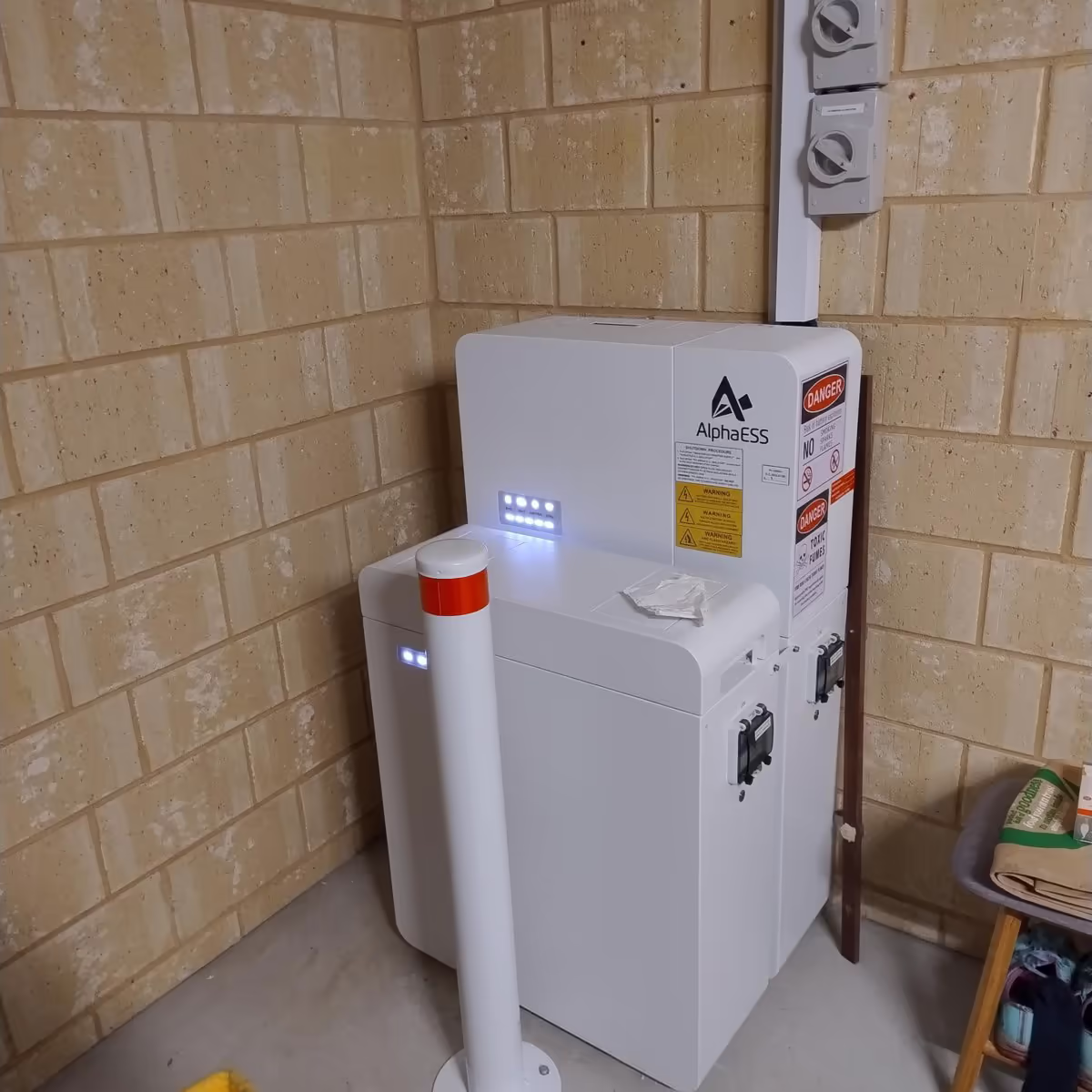 Alpha ESS batter installed in the corner of a garage
