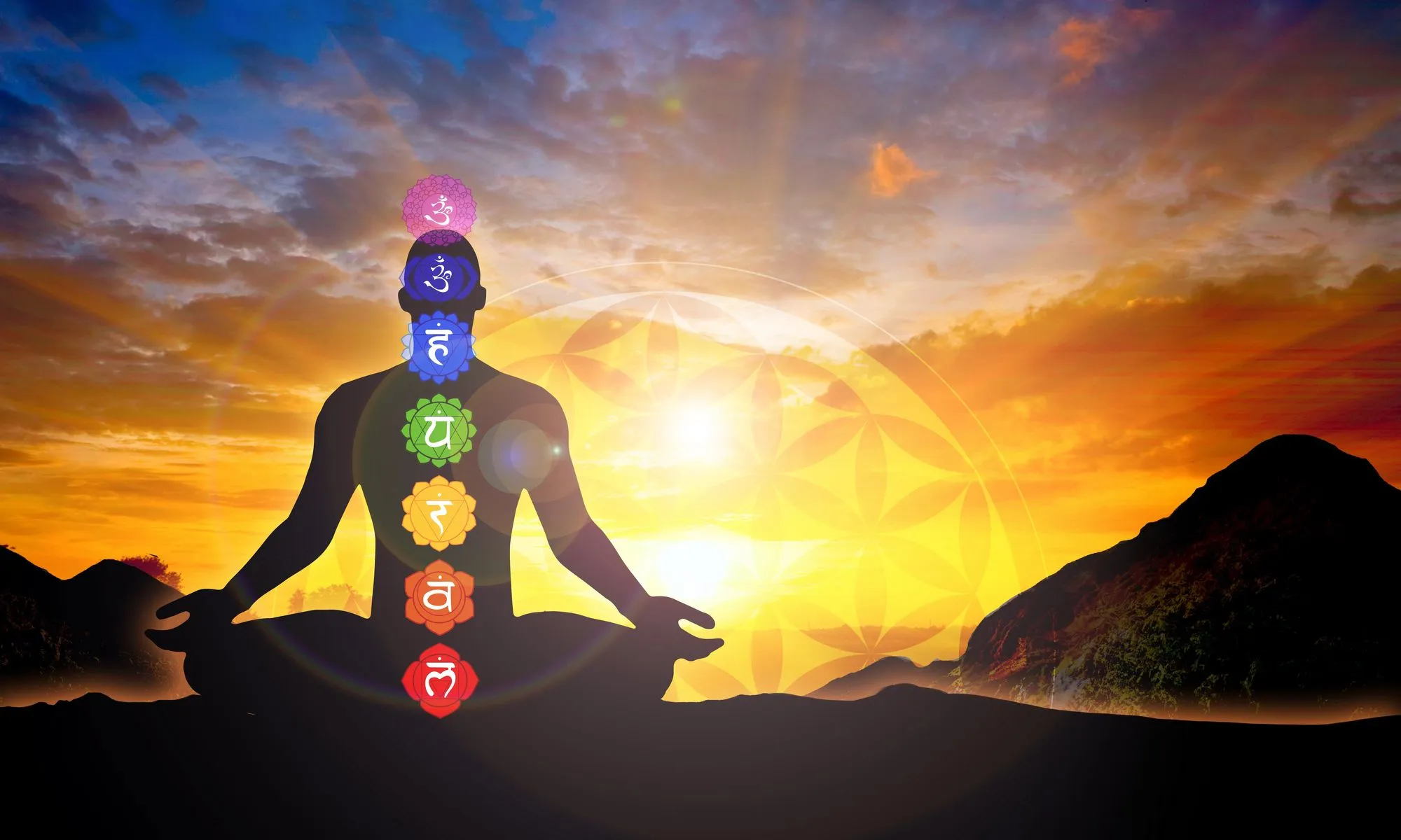 Meditating person in sunset