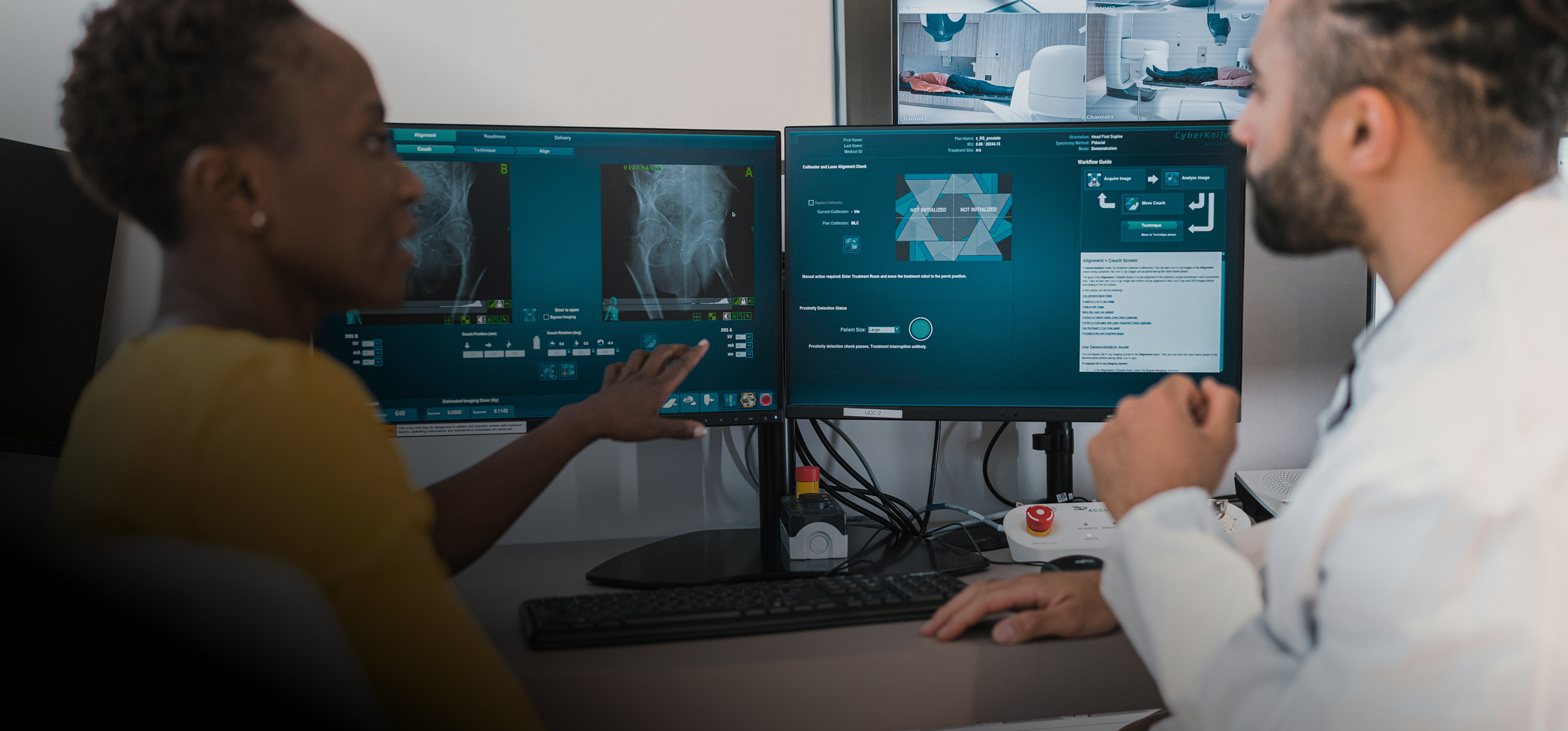 Two medical professionals reviewing digital X-ray images and treatment workflow on dual computer monitors.