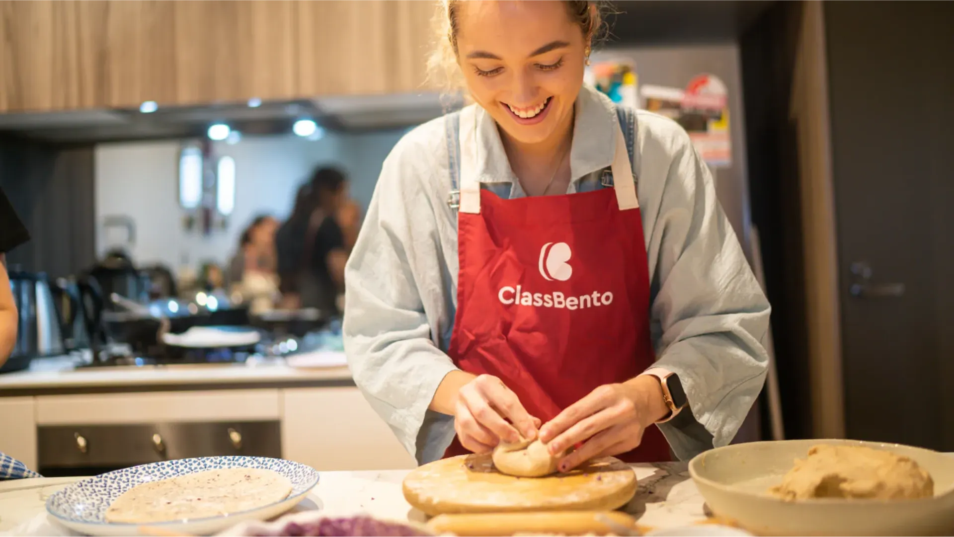 Woman cooking in ClassBento apron