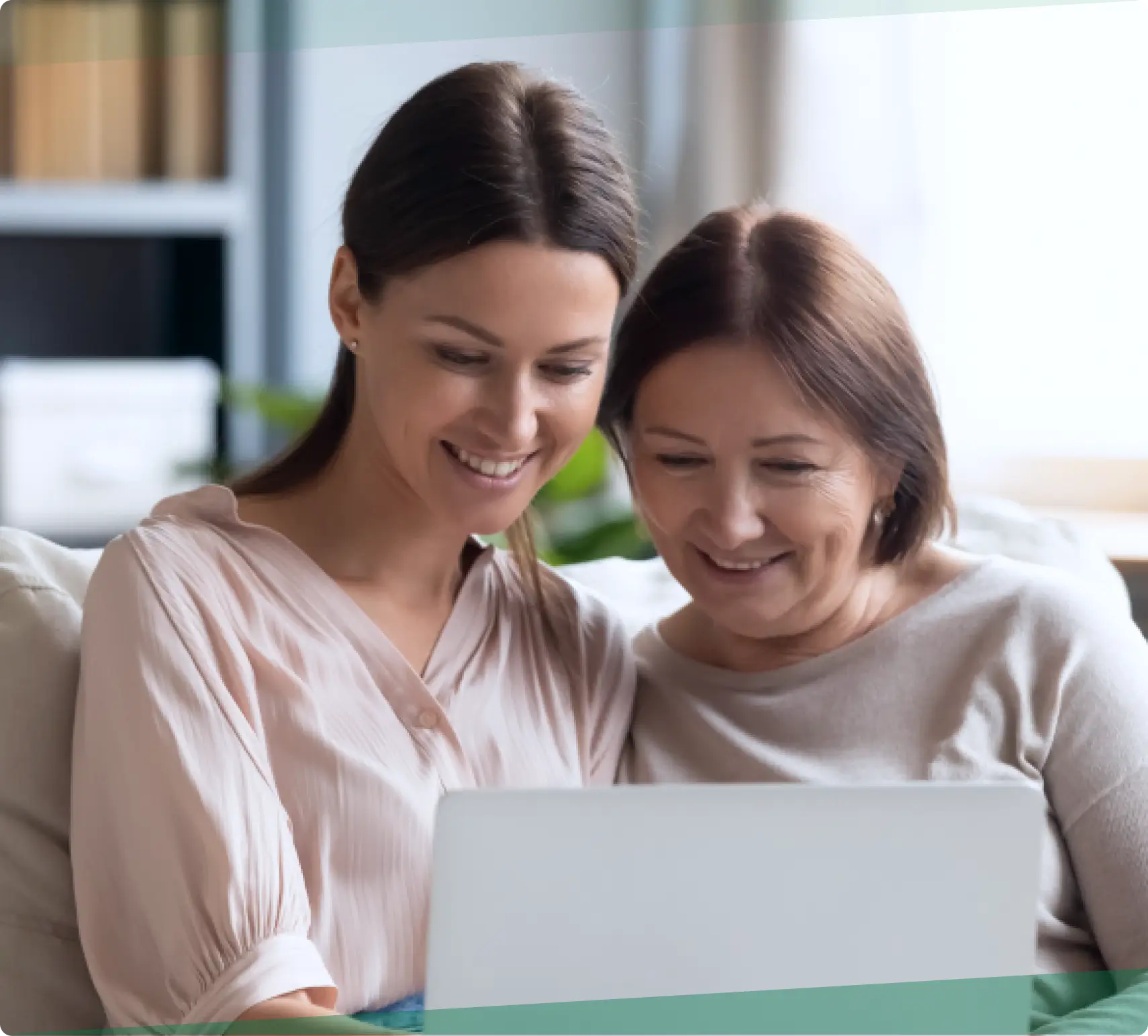 Daughter showing mother how to access Care Coordination