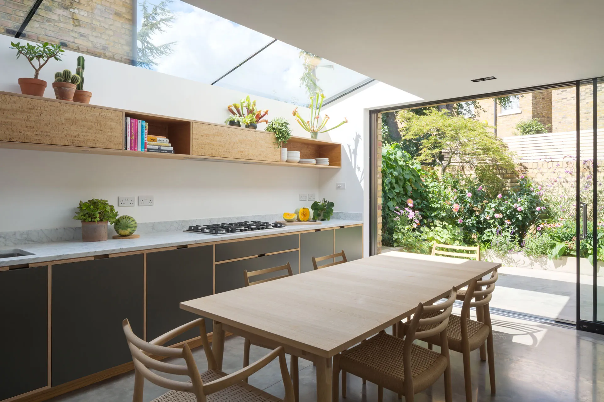 Bespoke plywood kitchen in open-plan modern space by Uncommon Projects