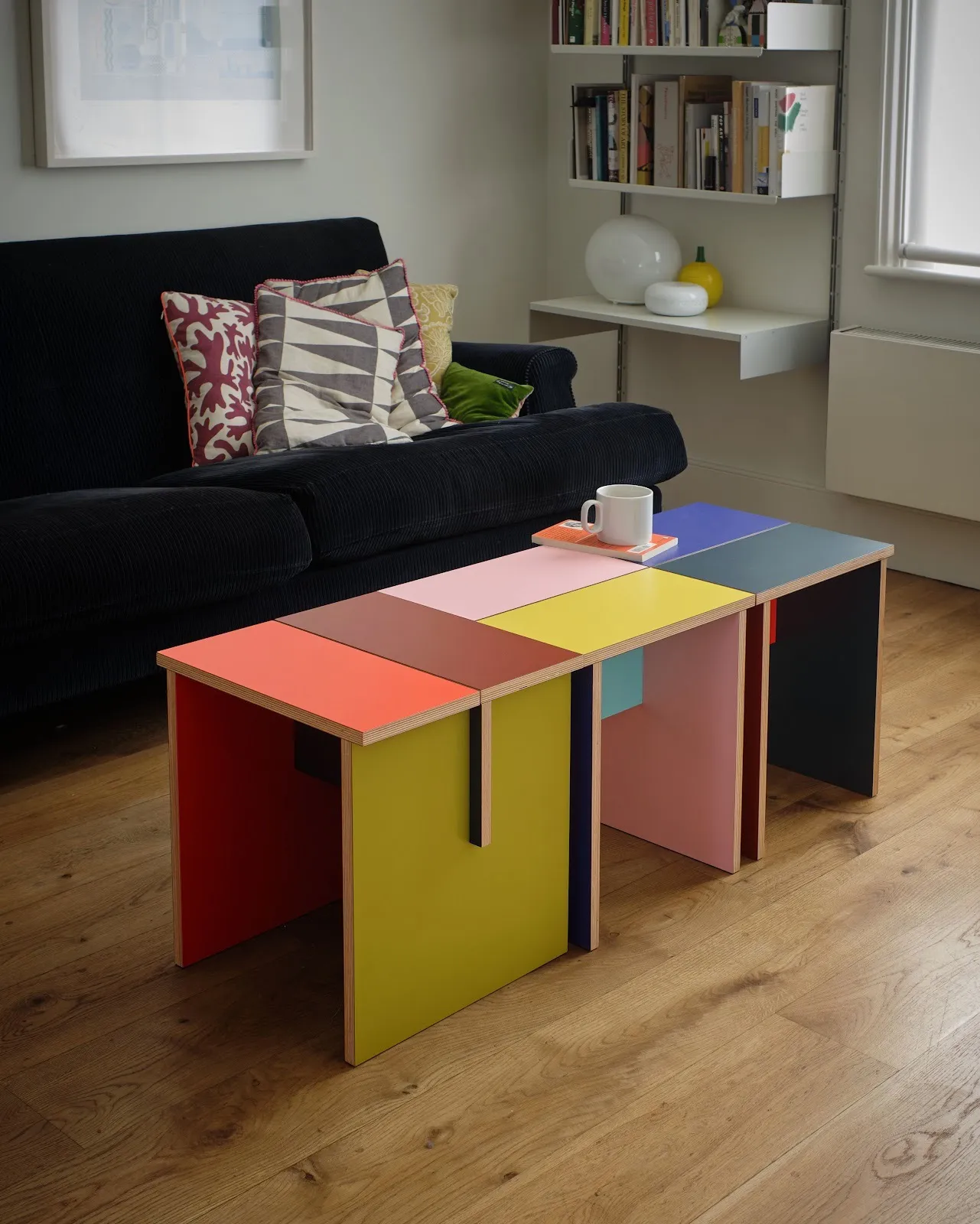 Three Combination Tables by Sophie Smallhorn arranged together as a coffee table in a domestic interior, demonstrating the modular design and vibrant colour combinations.