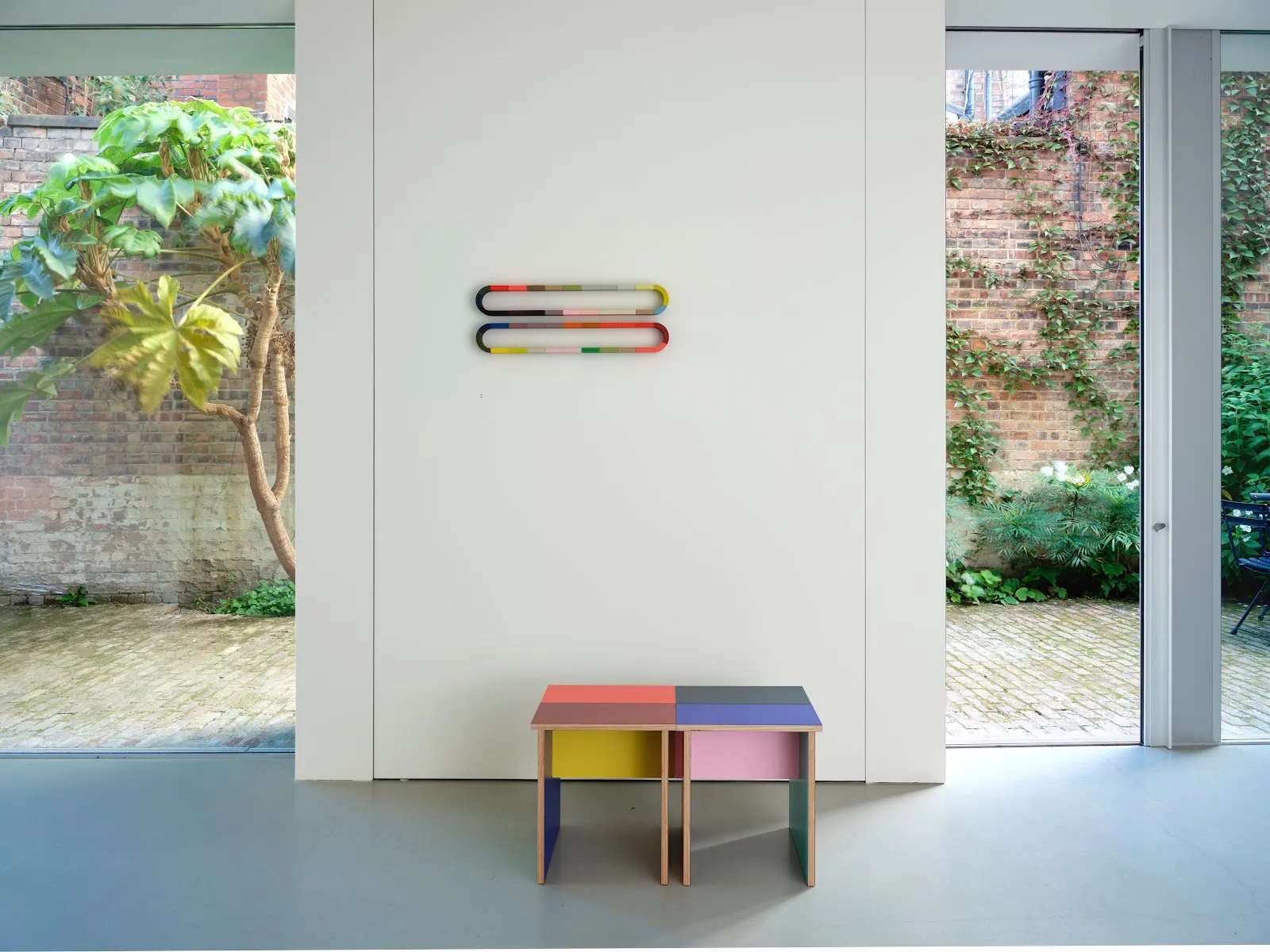 Installation view of Sophie Smallhorn’s exhibition at Timothy Hatton Architects, featuring the Combination Tables displayed alongside her sculptural and wall-mounted works.
