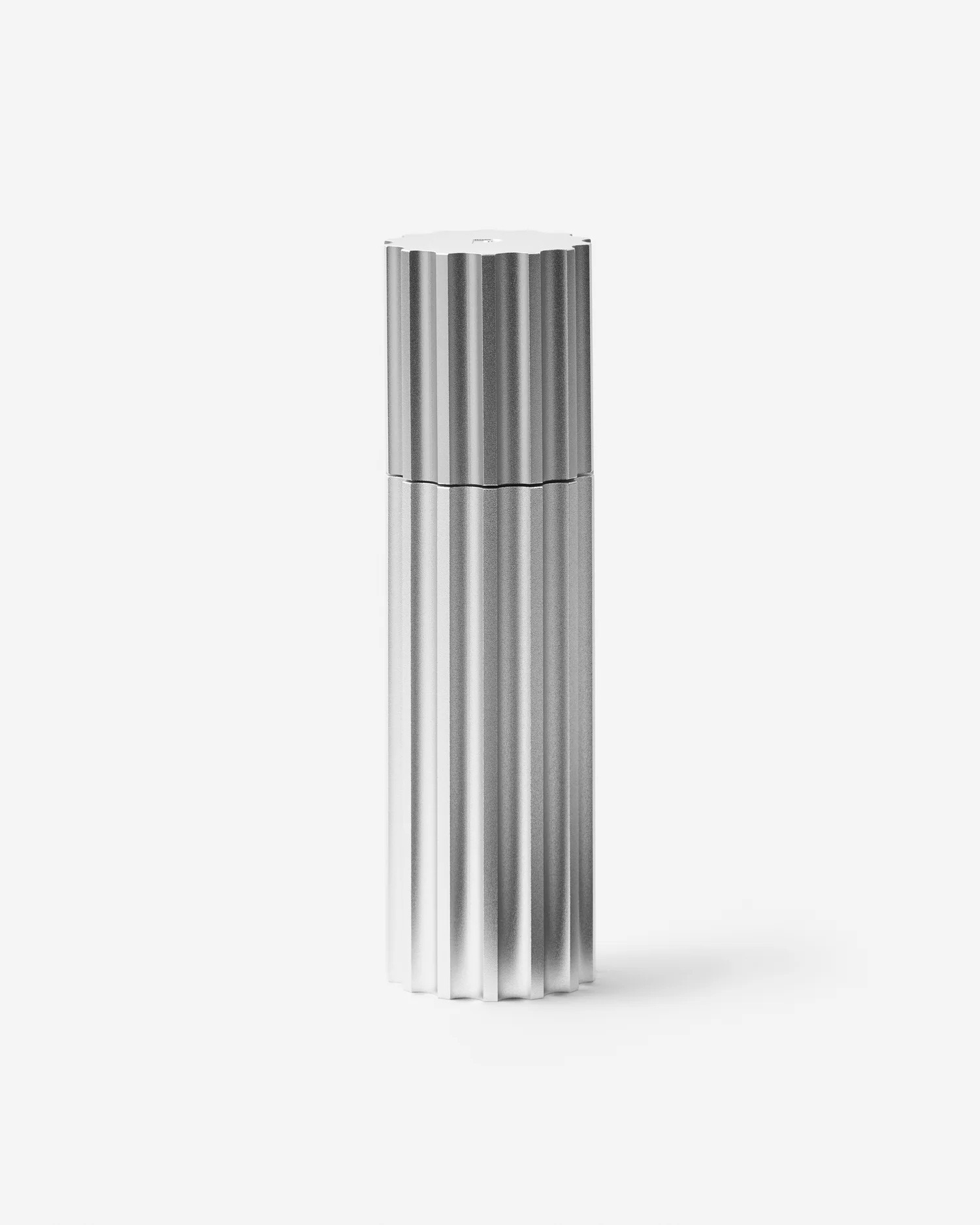 Service Projects aluminium pepper mill with fluted industrial design on a white background.