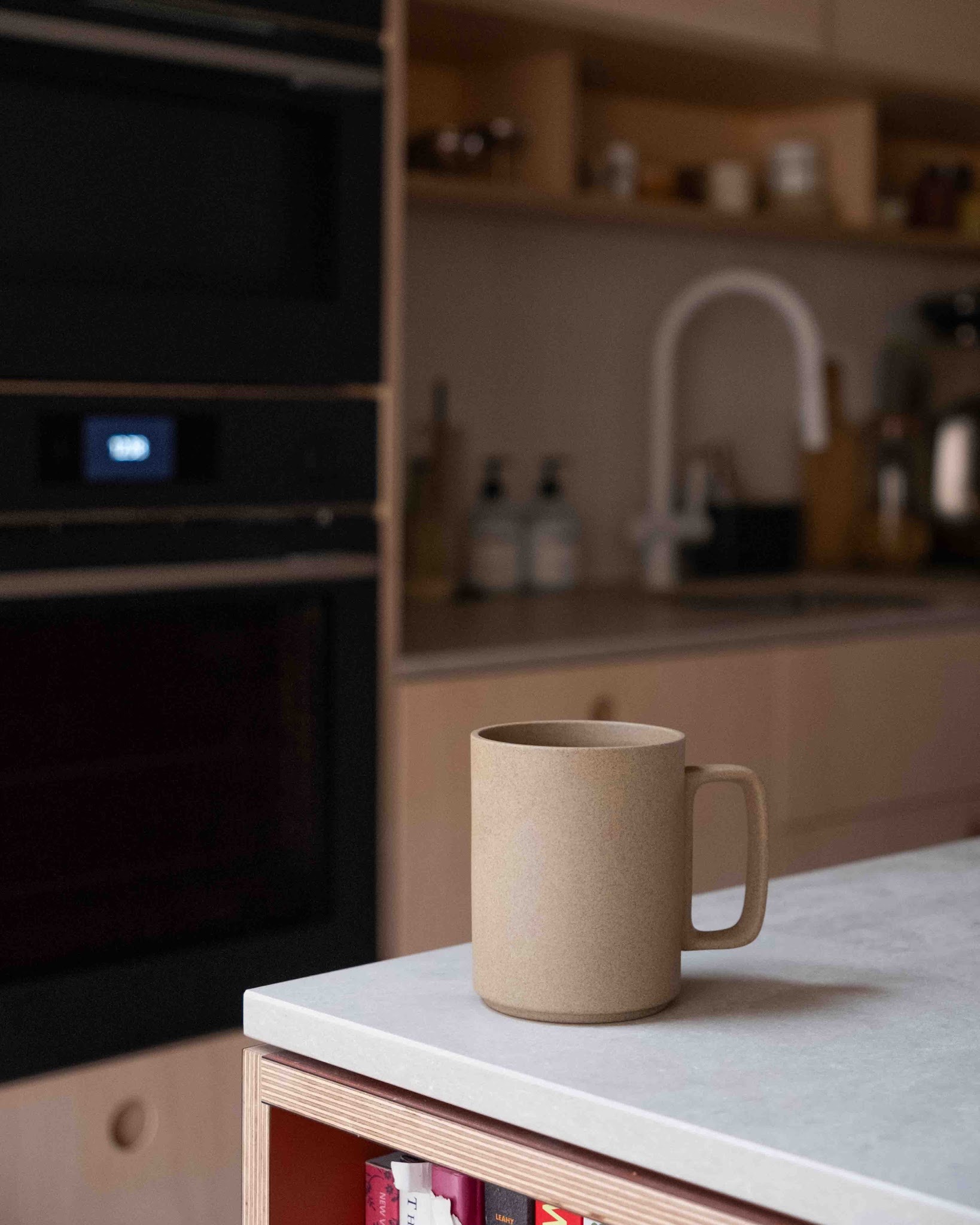 Unglazed Japanese Hasami mug on a plywood and stone worktop in Edd’s Uncommon kitchen.