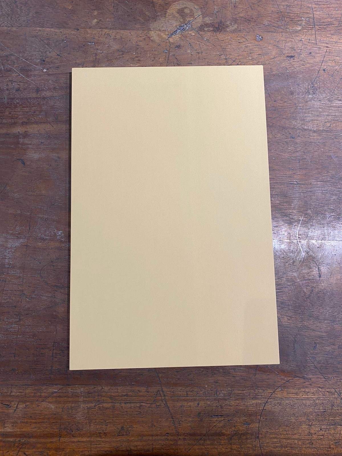 Japanese rubber chopping board shown on a wooden surface.