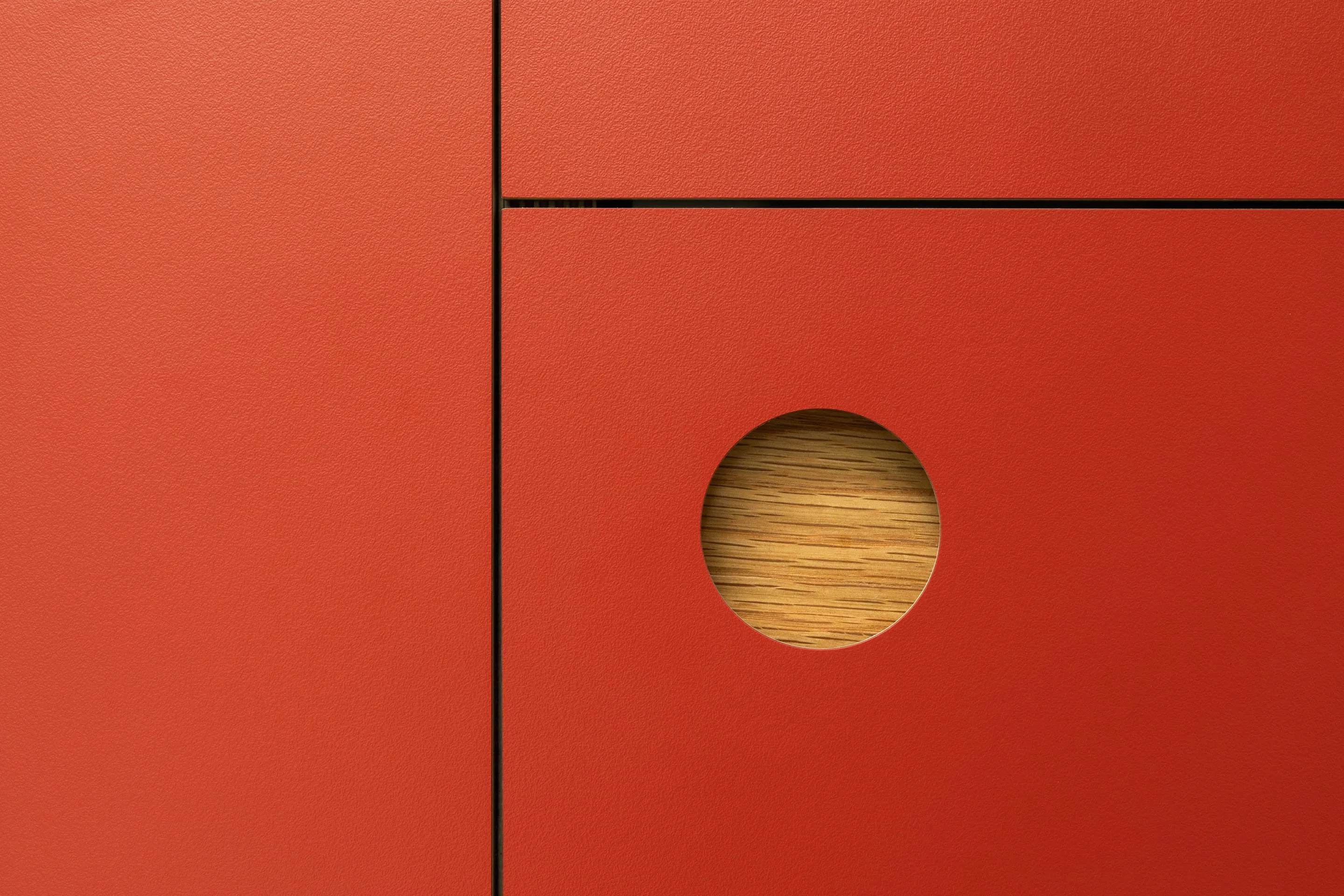 Detail of a Round recessed handle in an ‘Overlay’ style kitchen.
