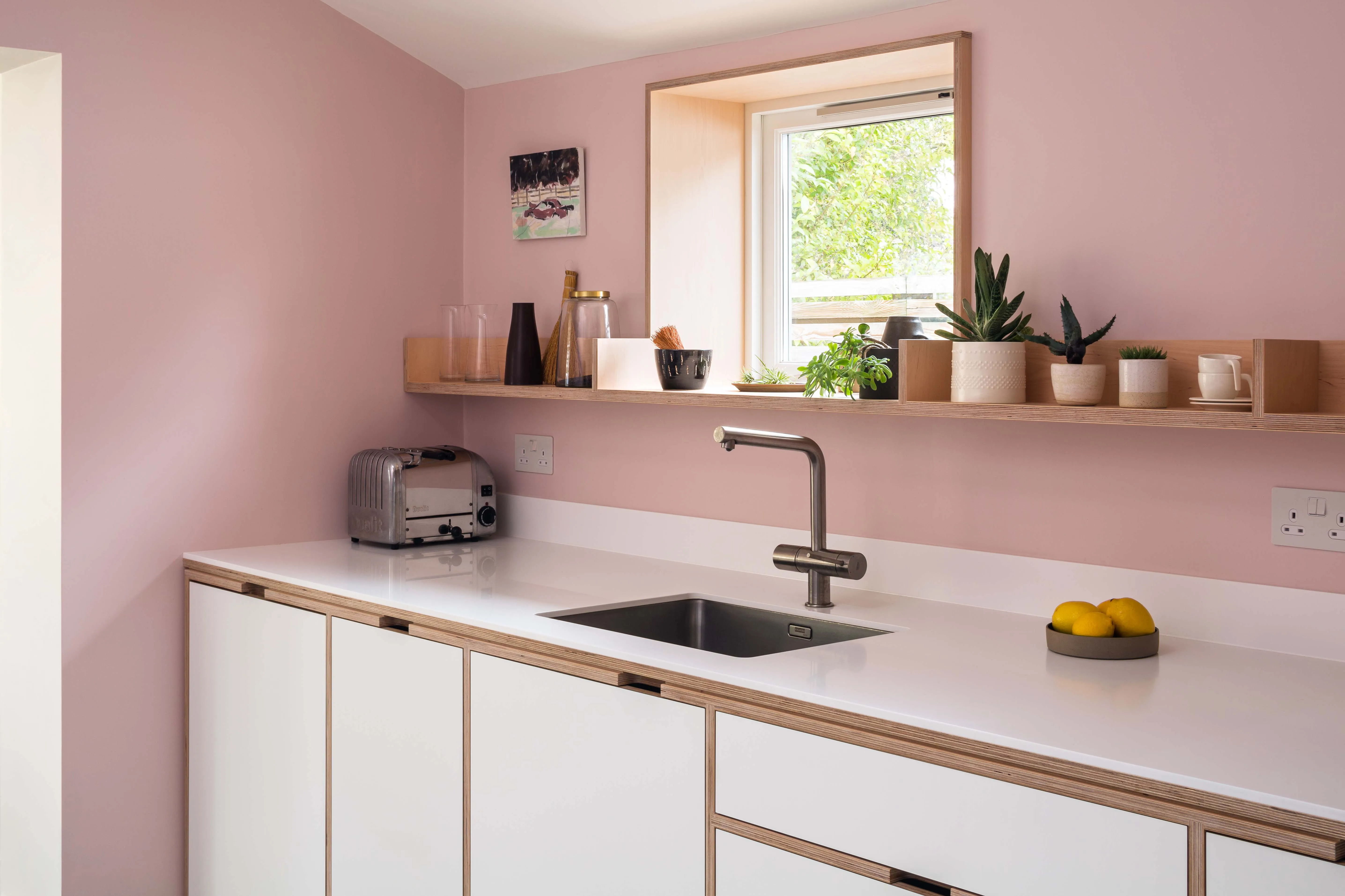 Sometimes all that’s required is a simple floating shelf. In this example, the shelf wraps into the window reveal.