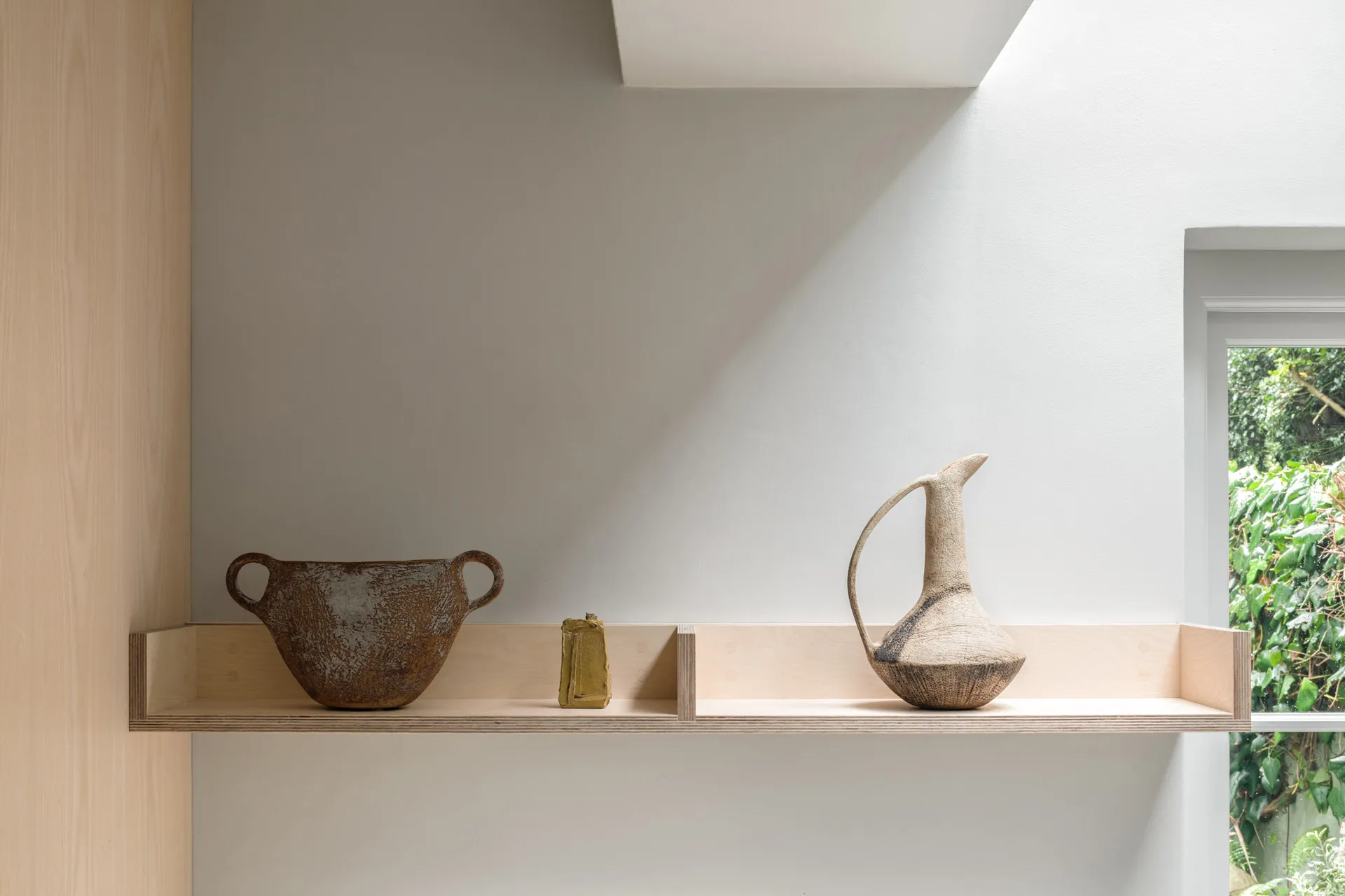 A simple open shelf can create a perfect place to display precious ornaments.