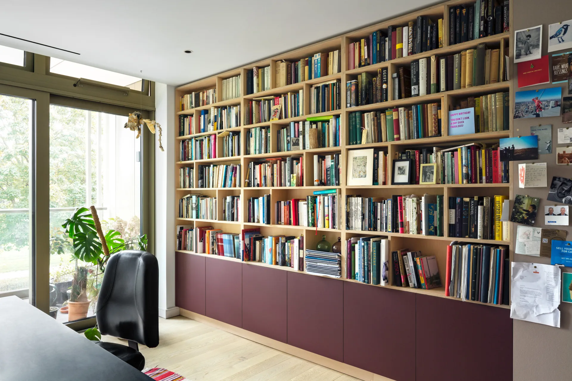 The ultimate writers room. This library wall features ‘overlay’ style doors at low level.