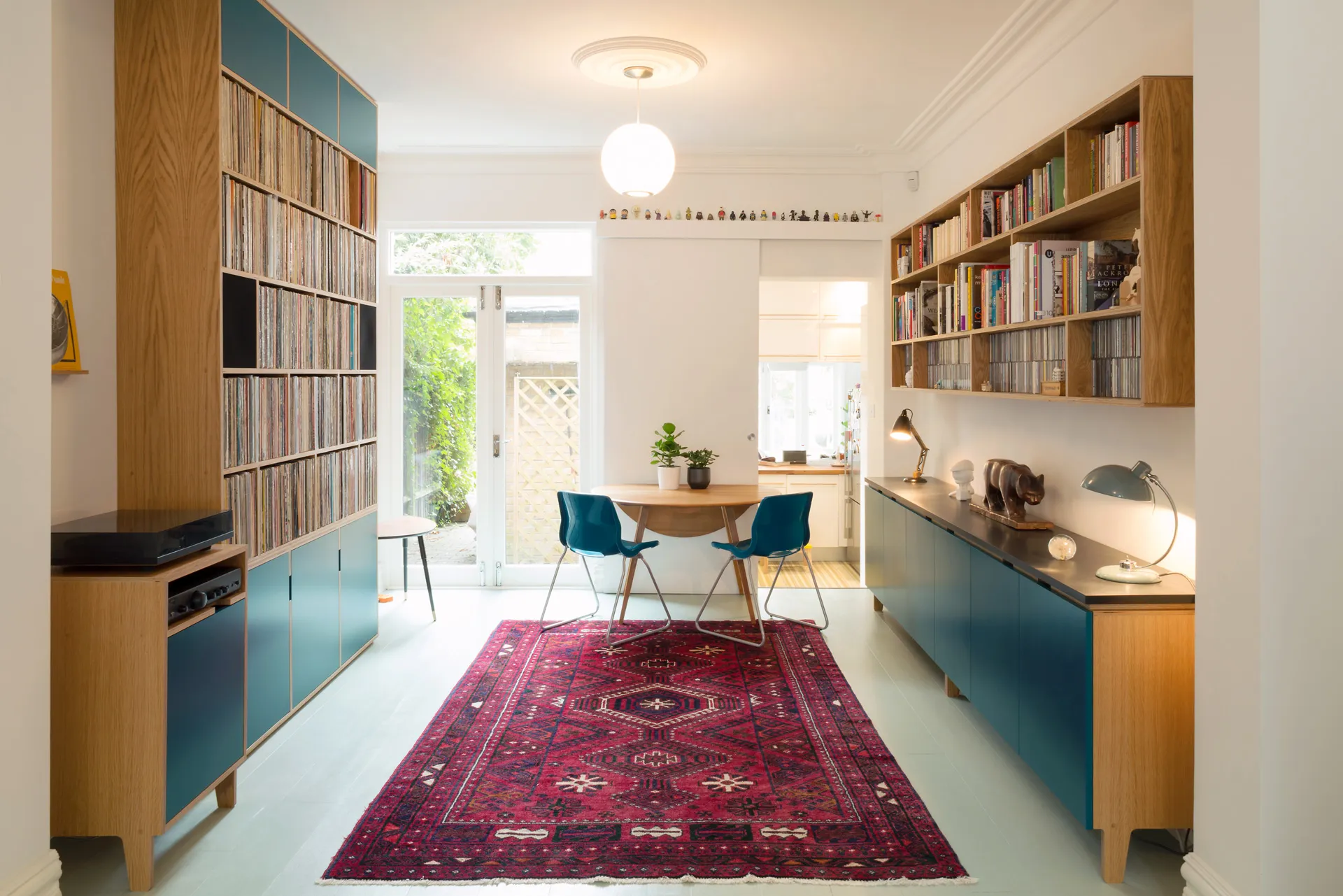 A large wall unit and bespoke sideboard complete this music lovers dream room.