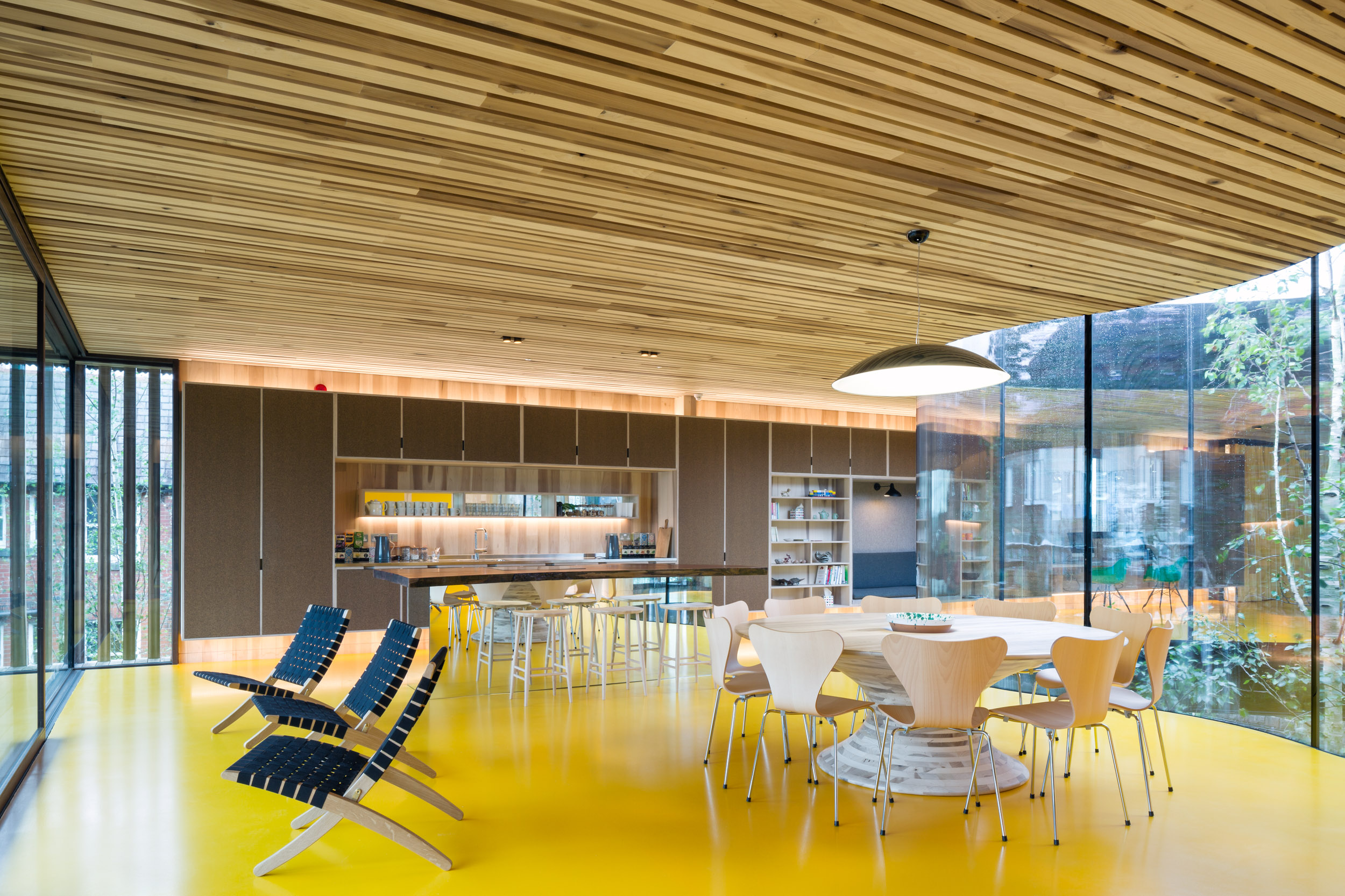 Maggies Oldham. Mirrored island, bright yellow floor Bespoke Ply Kitchen Circular Design