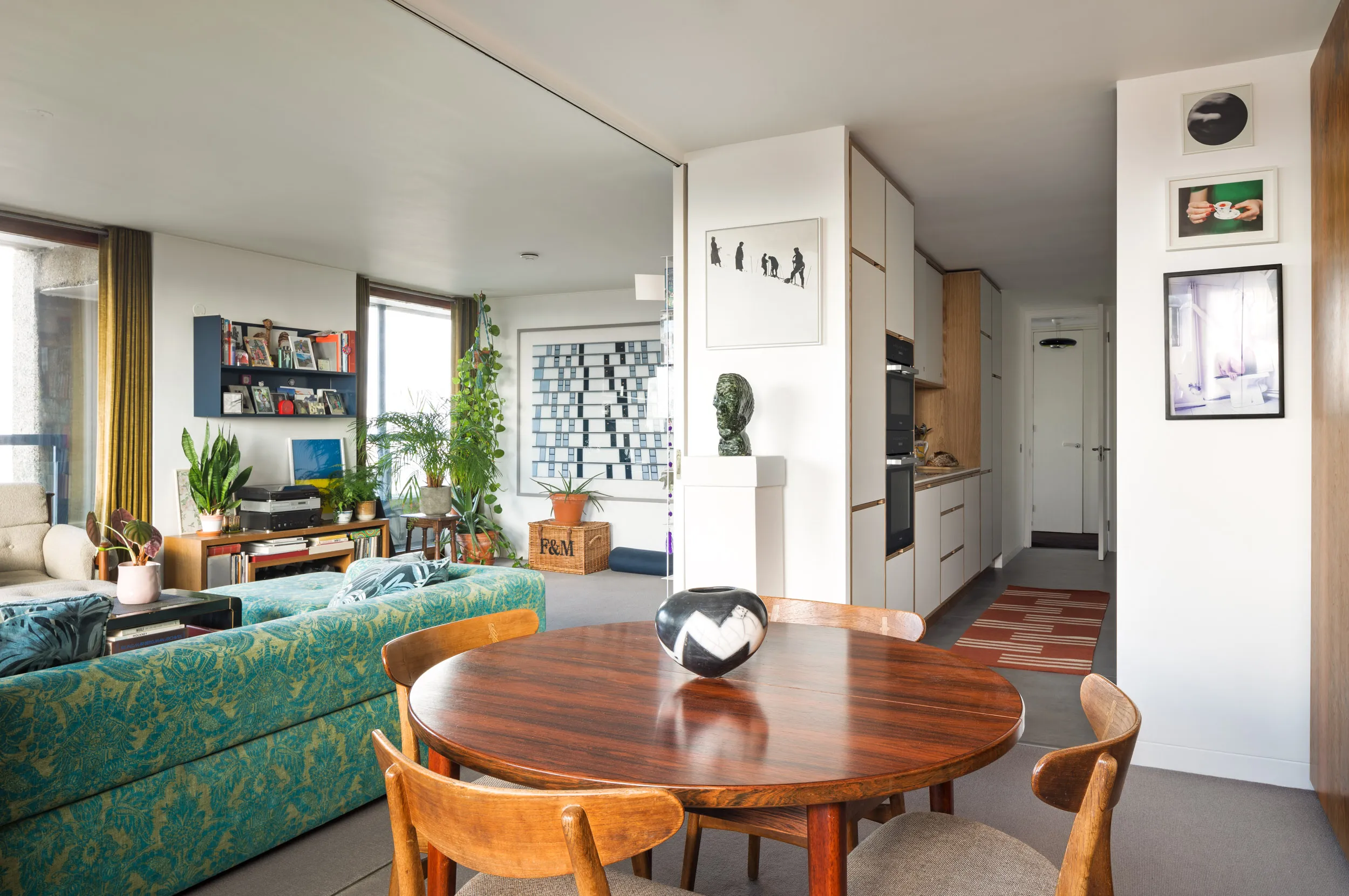 Mid century living room and galley kitchen in the Barbican 