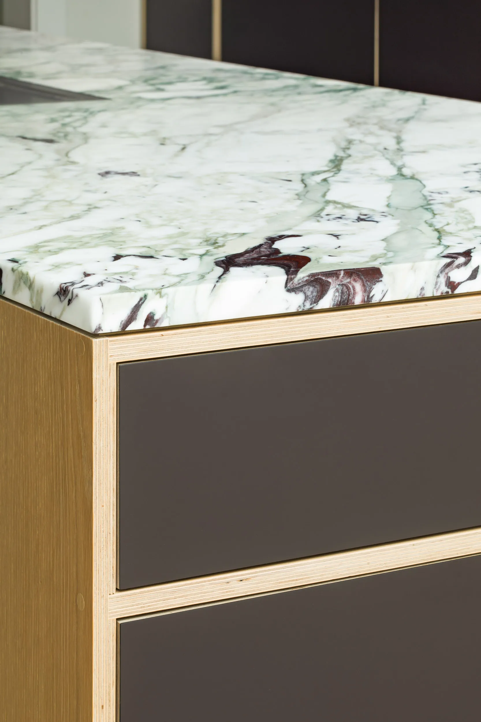 Island detail, with plywood and veined marble 