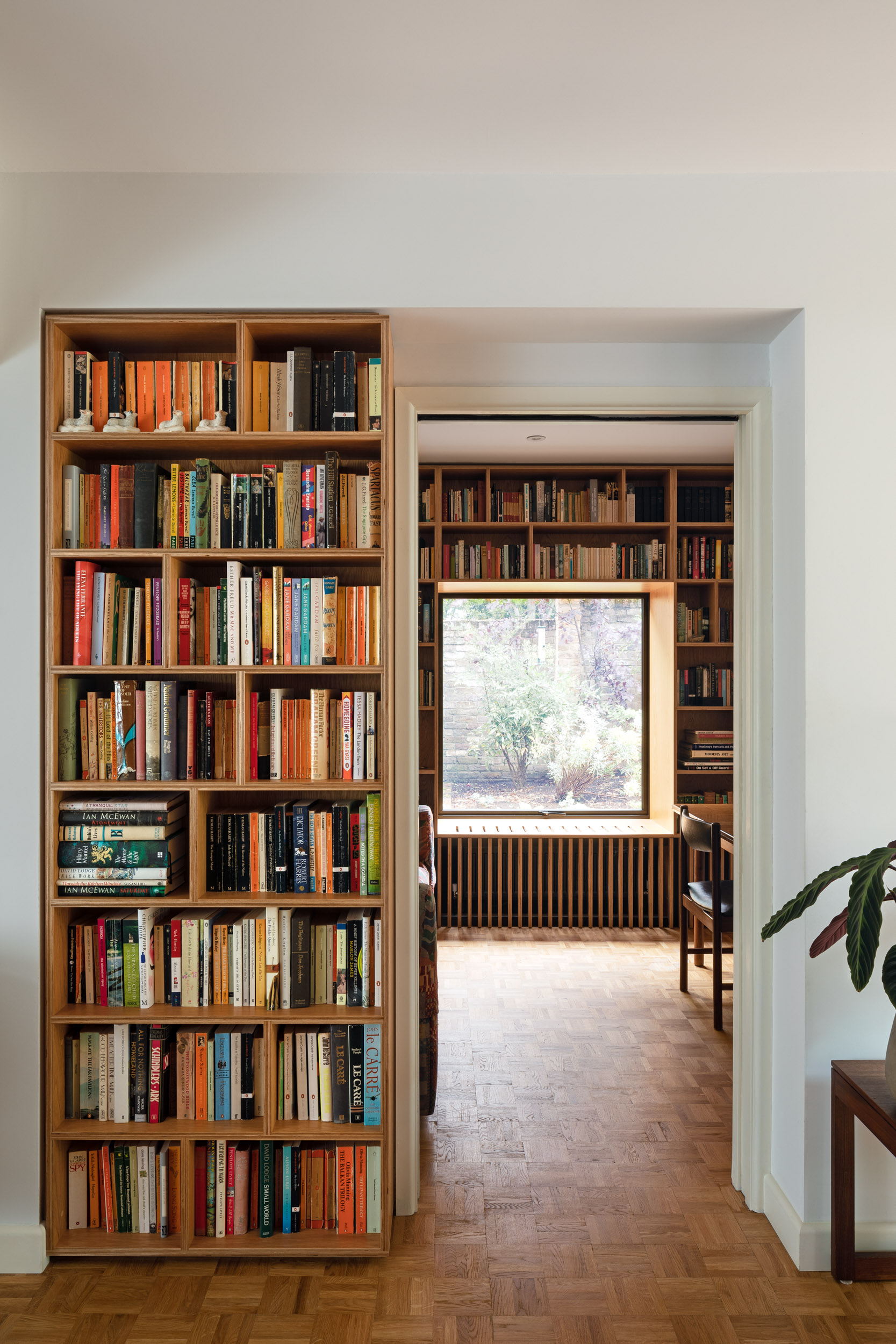 Plywood bookcase in architectural recess