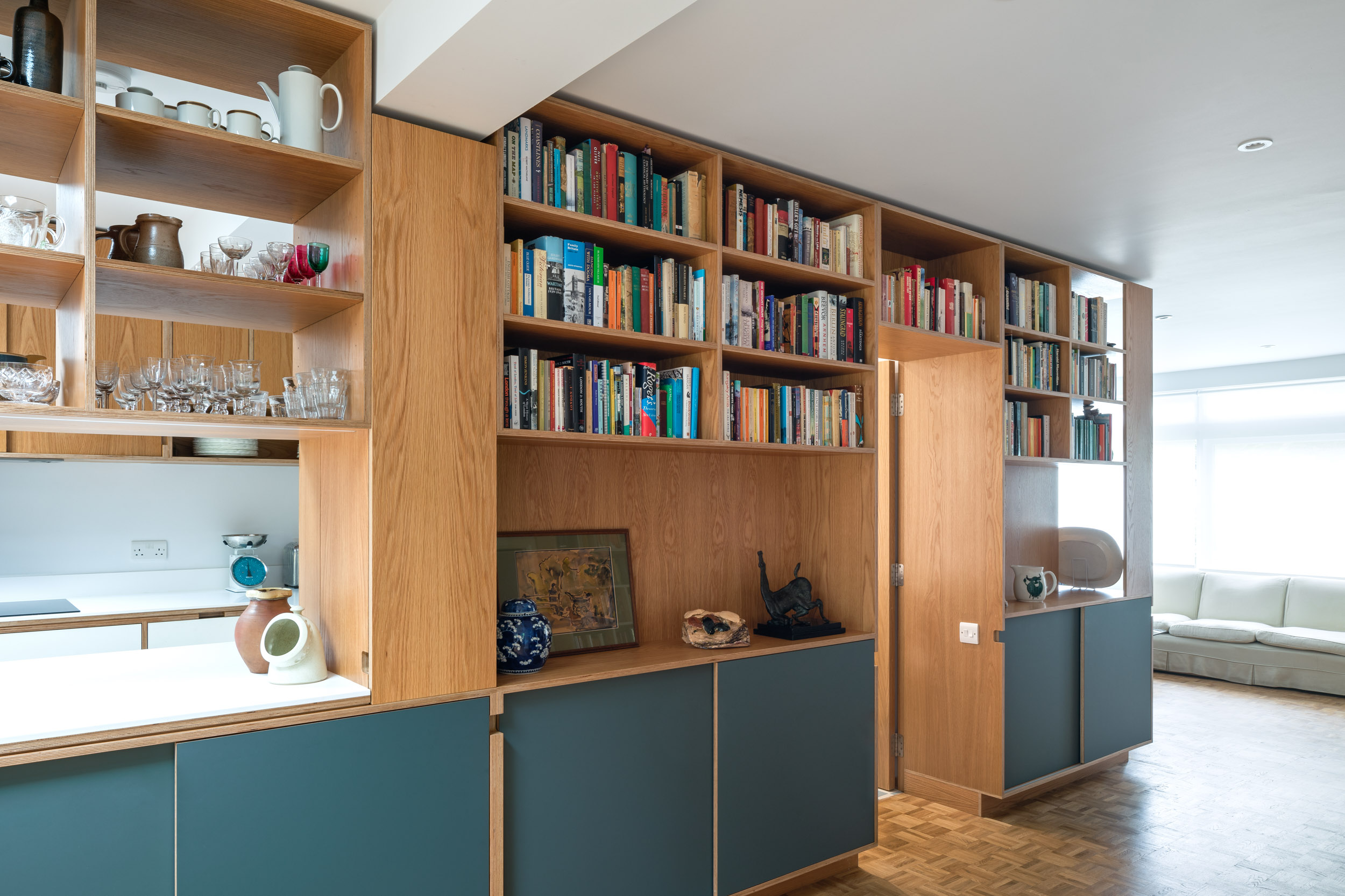 Oak ply furniture with hidden door to bathroom