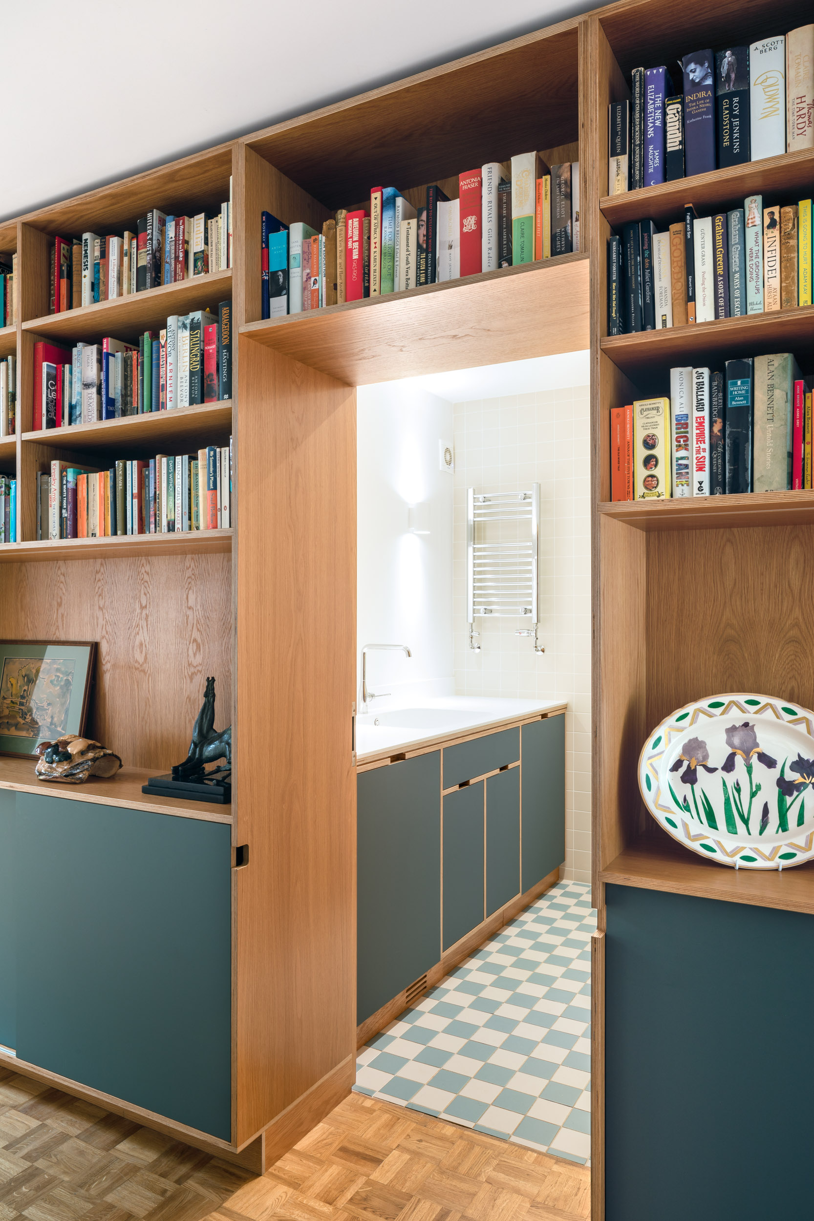 View into bathroom with plywood furniture
