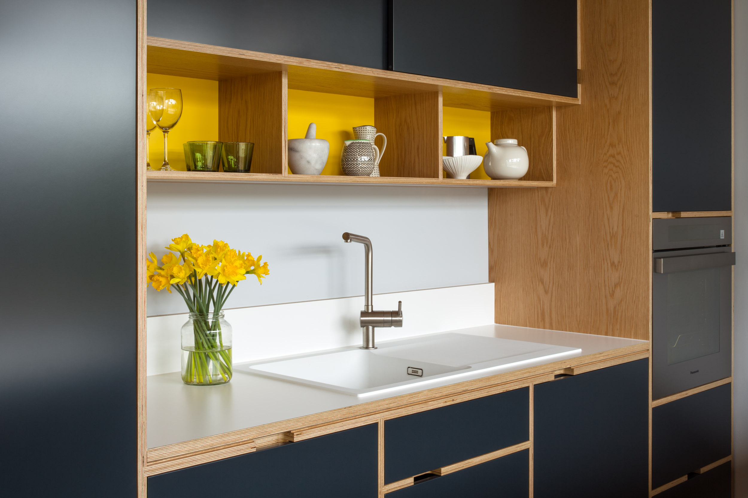 Bespoke plywood kitchen details. Corian worktop