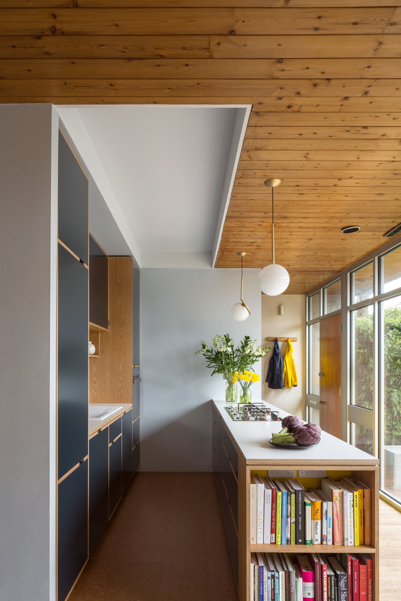 Wood panelled ceiling galley kitchen in bespoke plywood