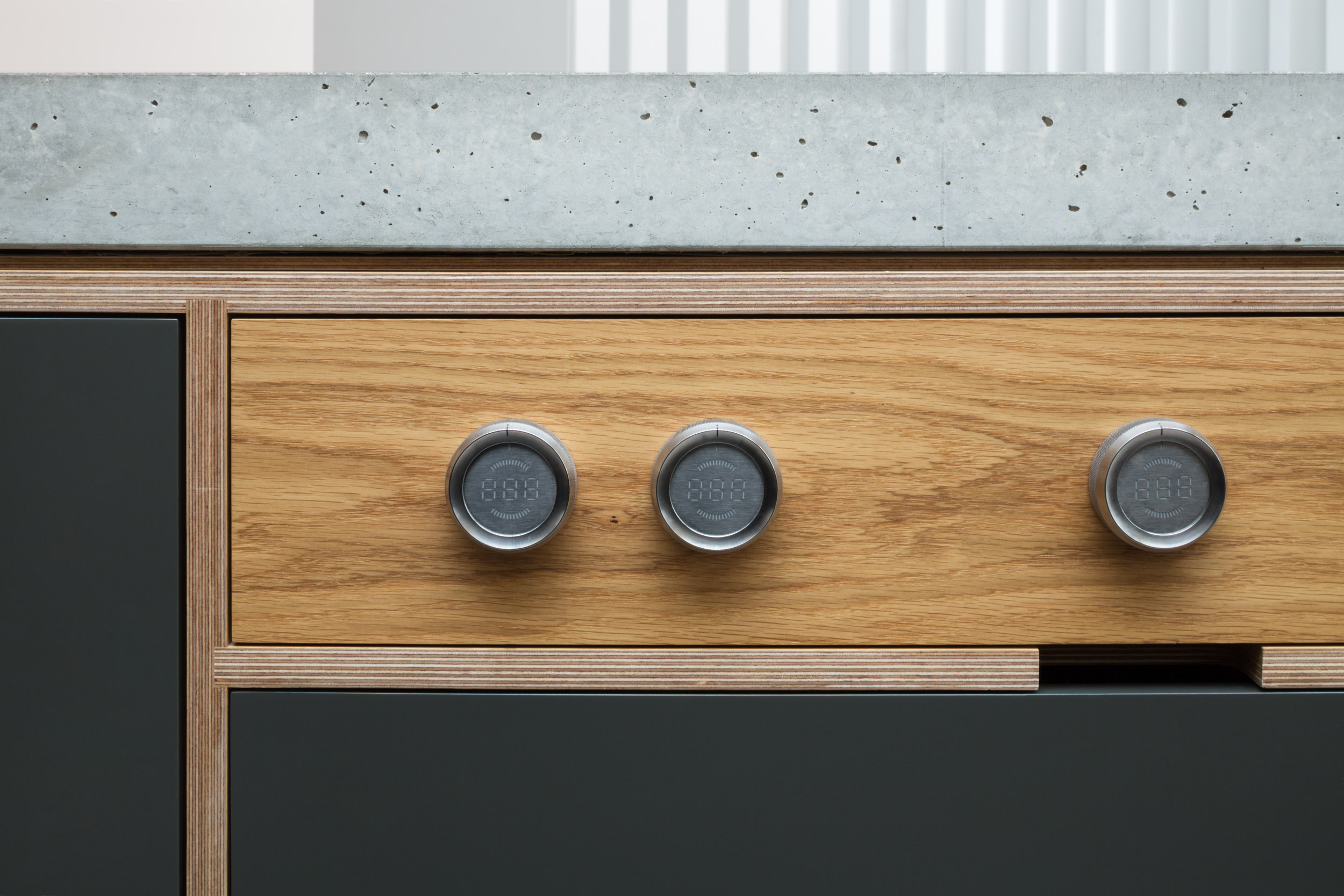 Oak plywood Bora dial detail with concrete worktop
