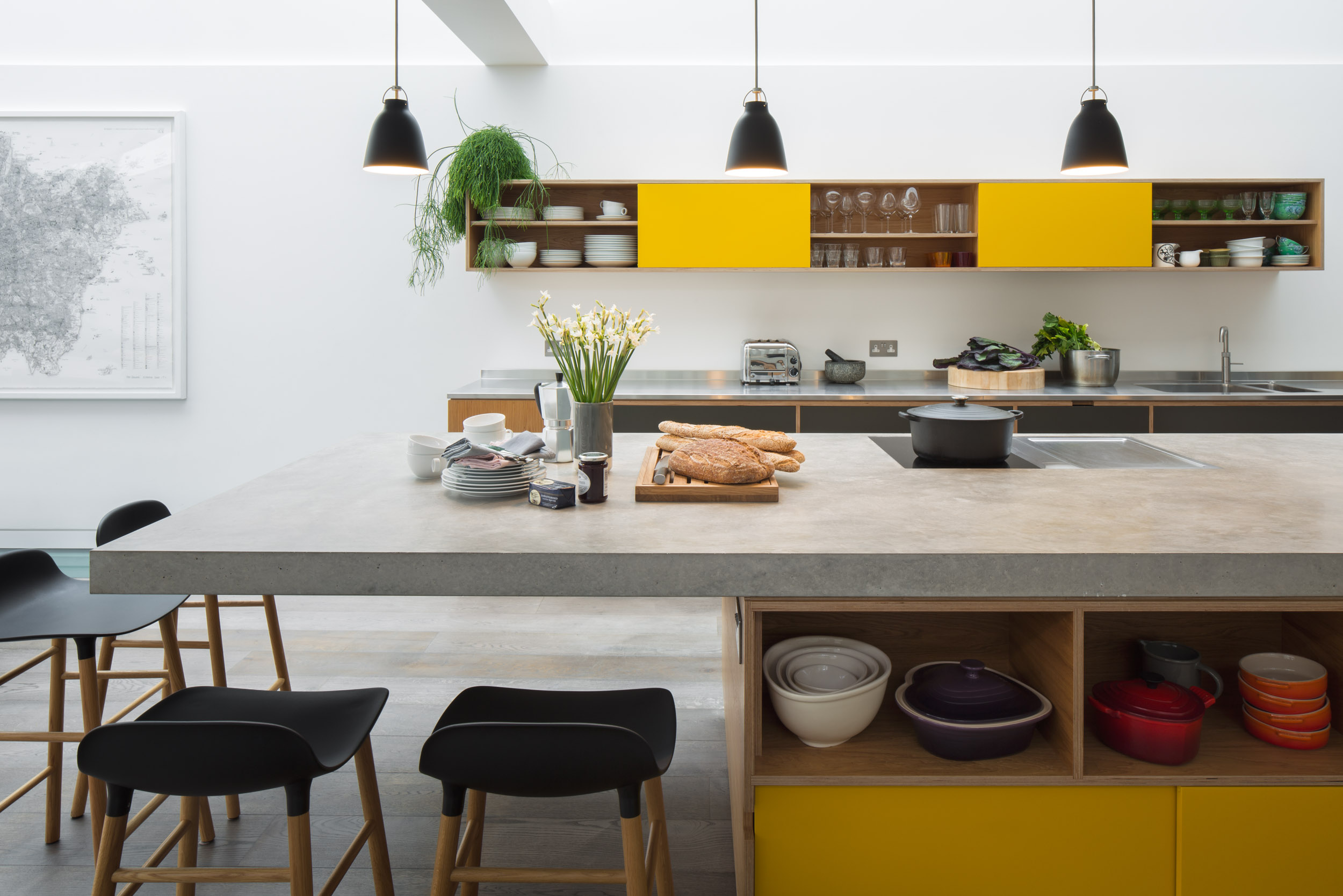 Concrete cantilever worktop on bespoke plywood island