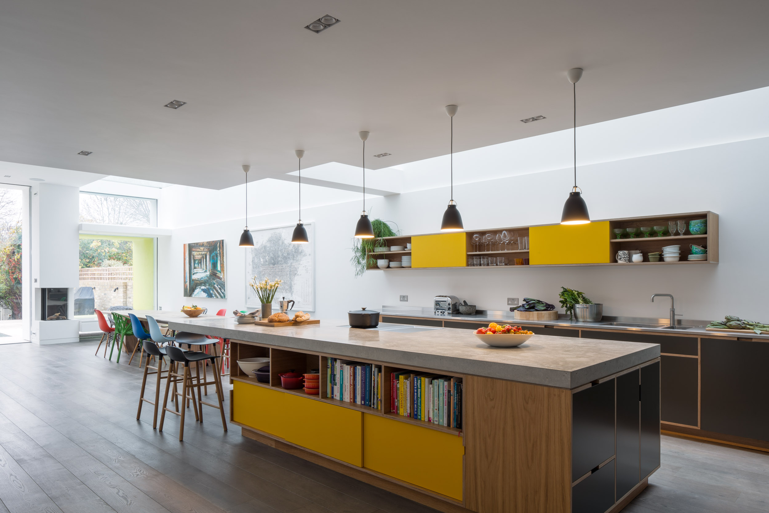 Giant concrete cantilever worktop on bespoke plywood island