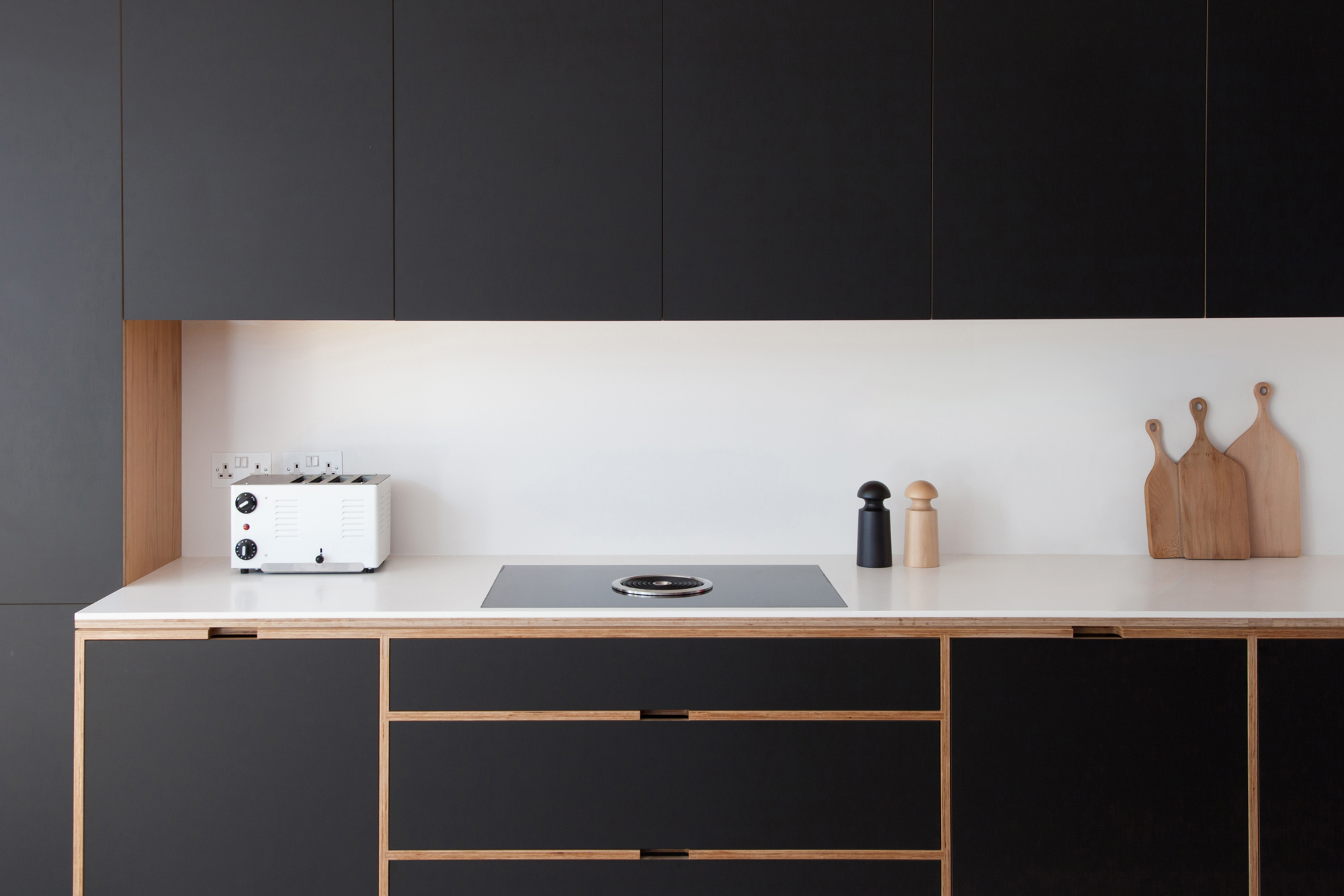 Straight shot to matt black plywood cabinetry