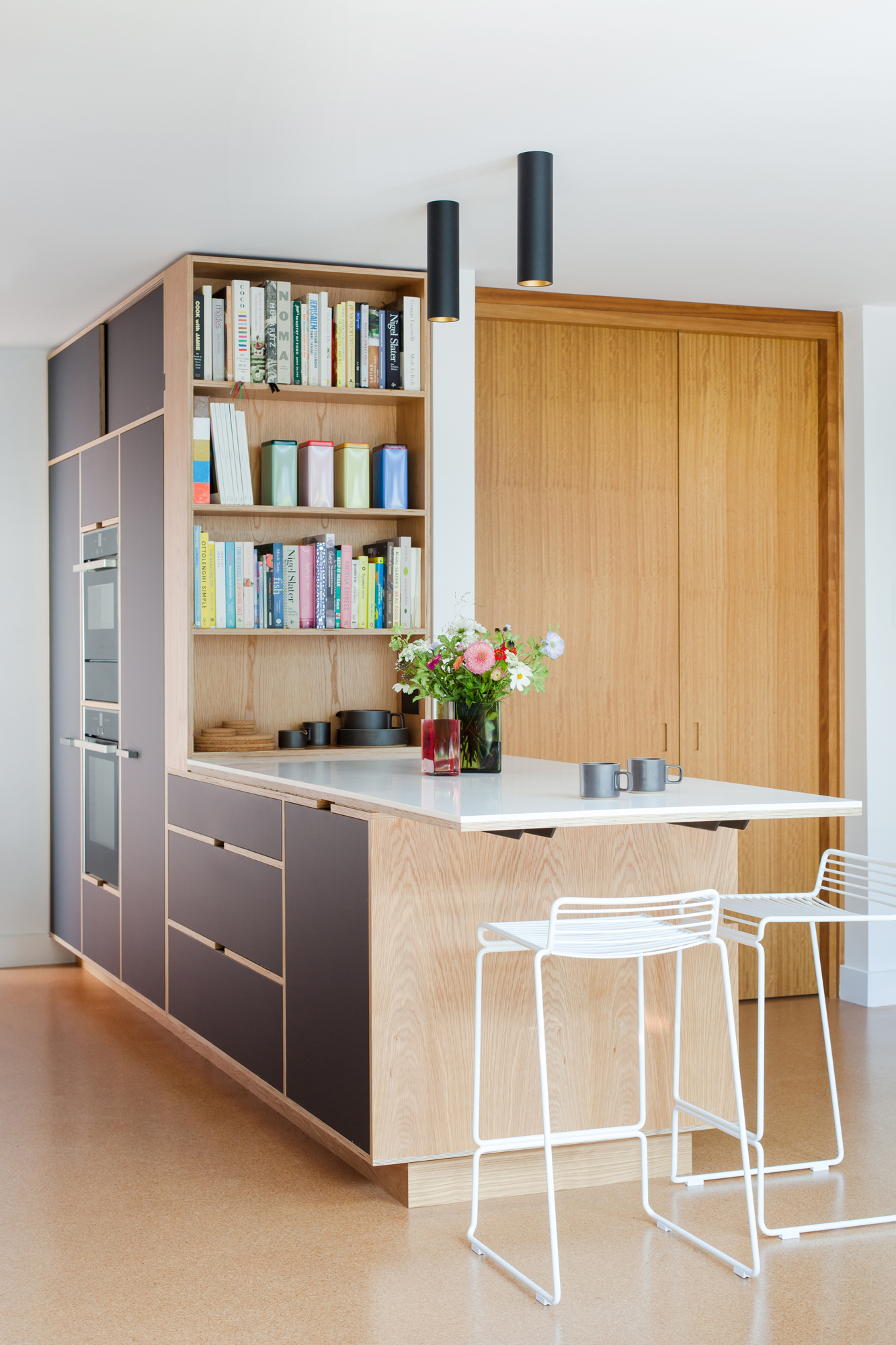Unusual peninsula with bookshelves and full height cabinetry