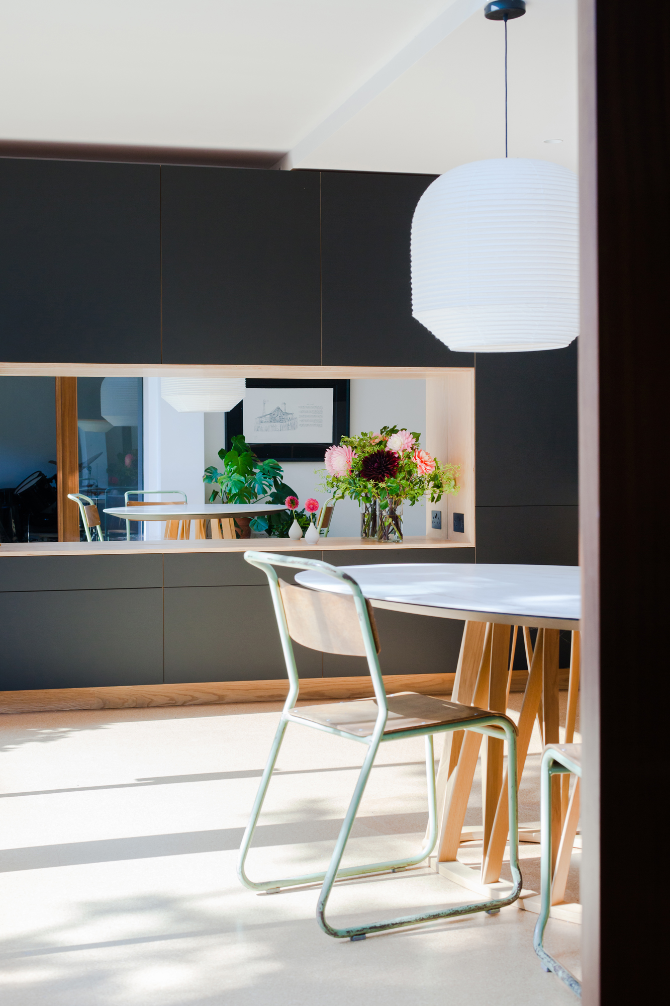 Overlay matt black doors on plywood mirror framed cabinetry