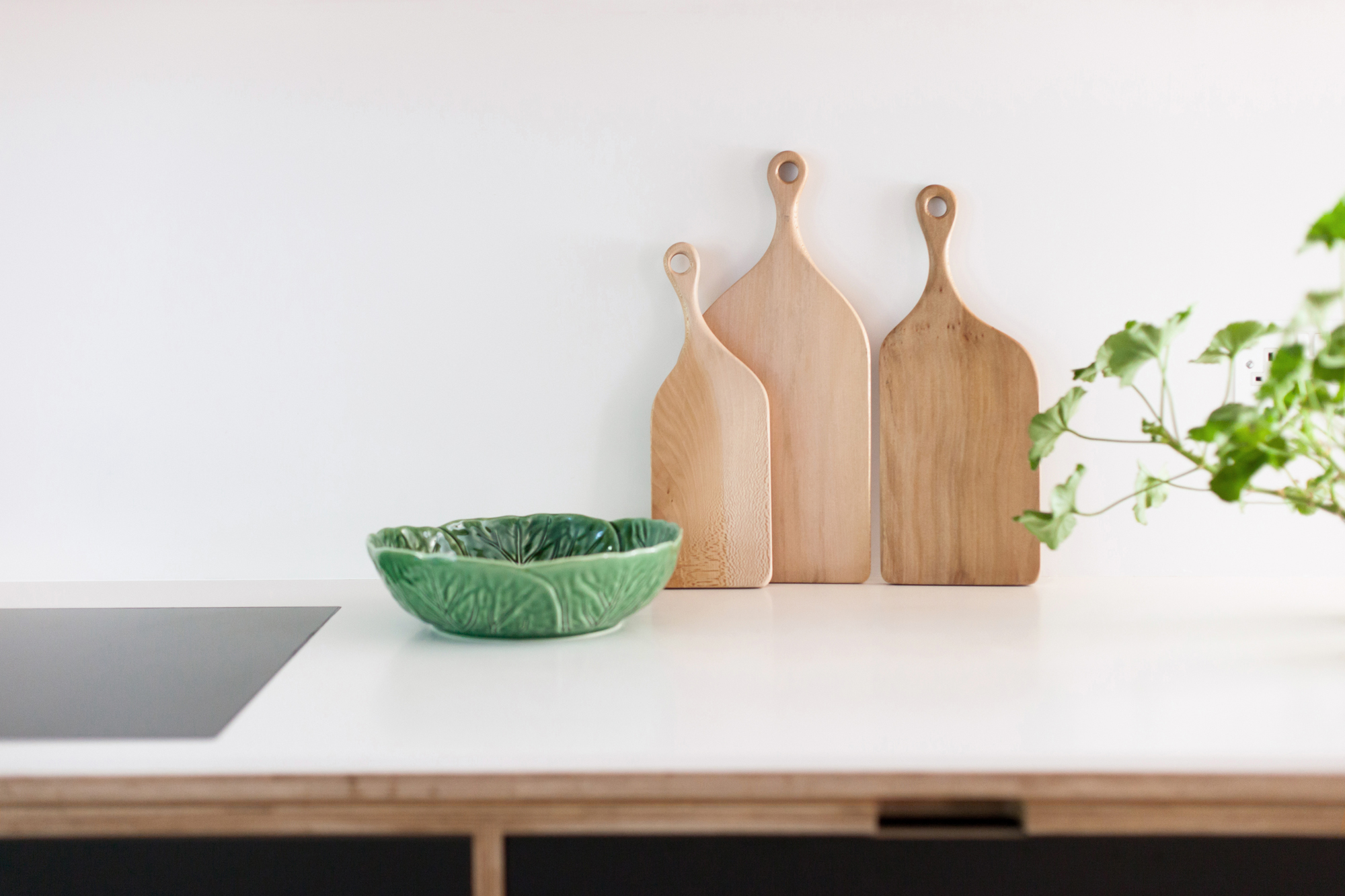 plywood furniture with chopping boards and geranium 