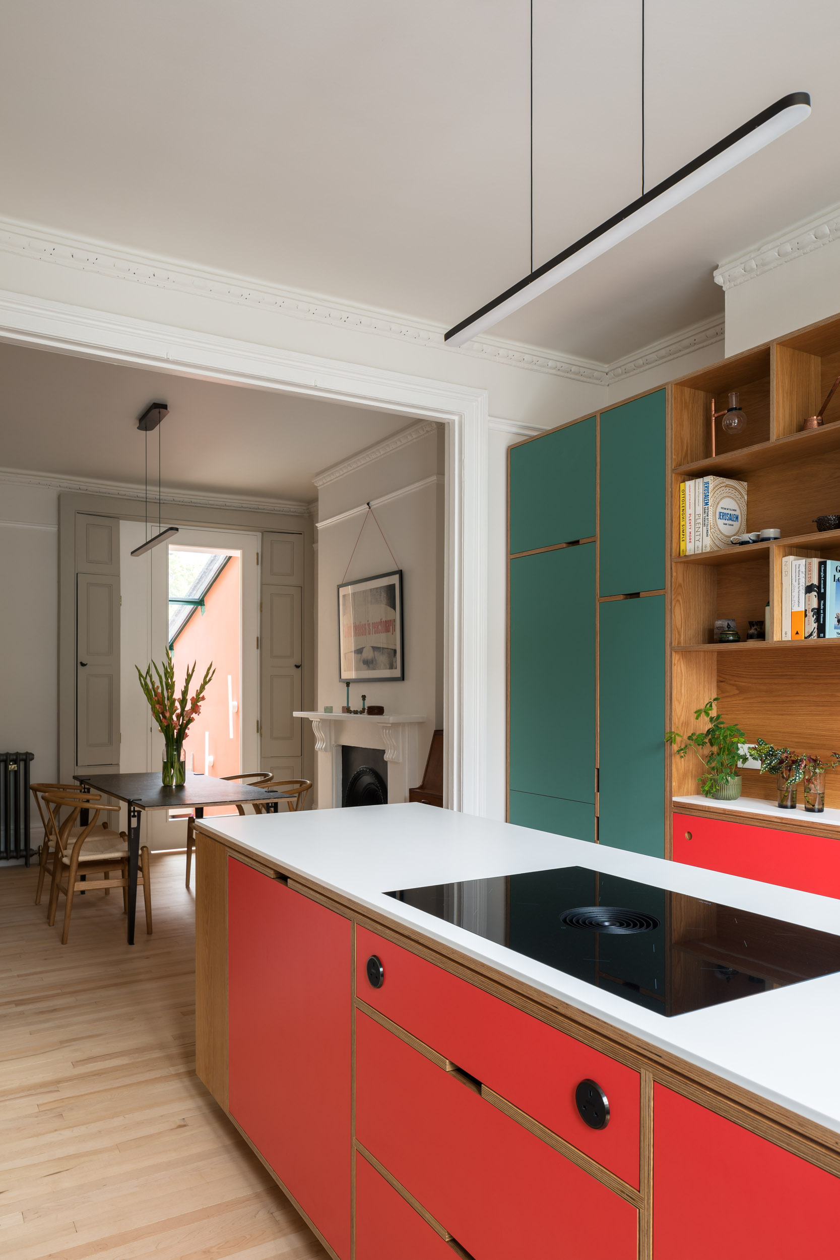 Red formica laminate island with oak veneered plywood.