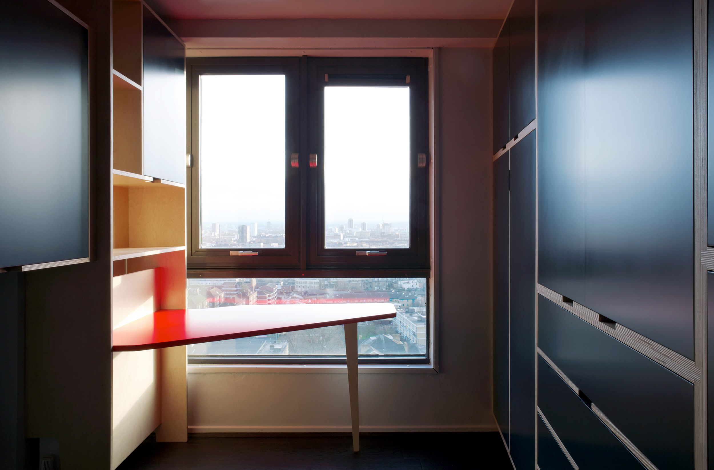 Red Ply Table Overlooking London Skyline