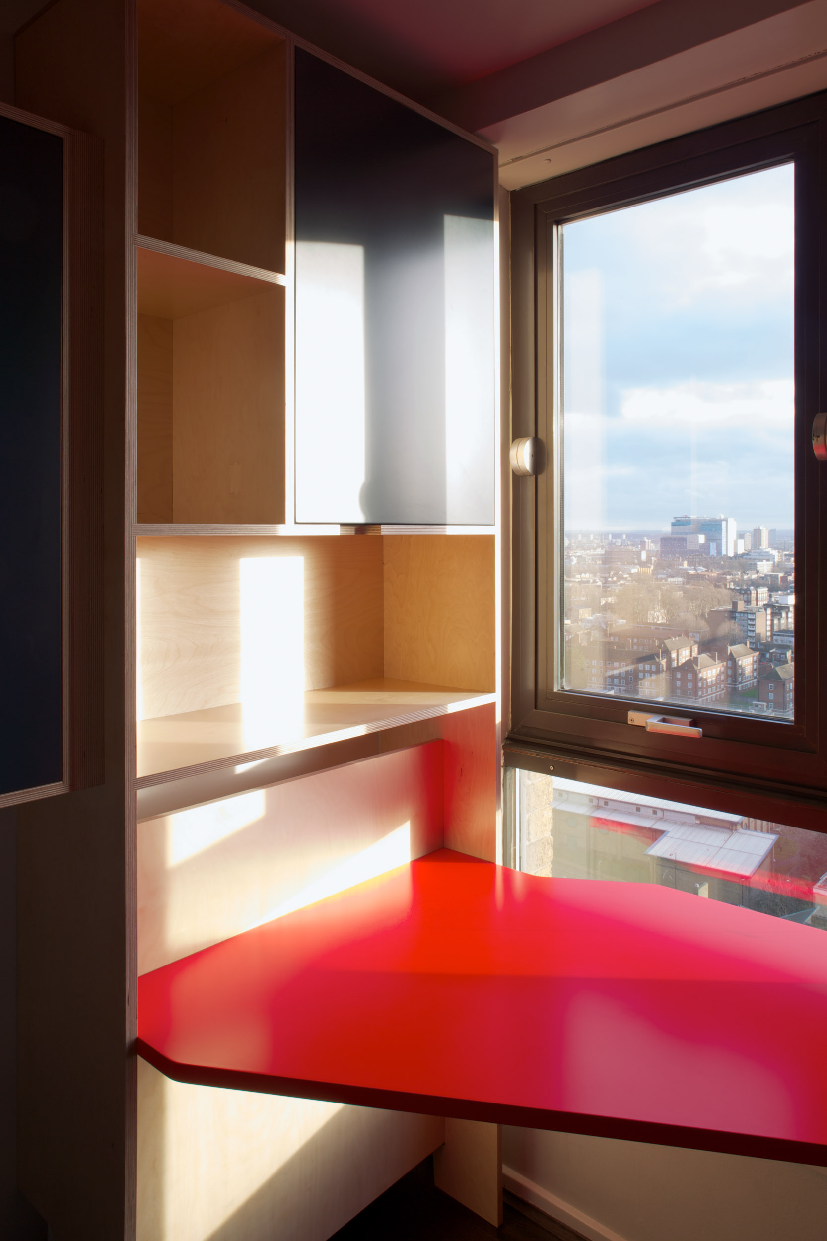Red Plywood Desk Overlooking London