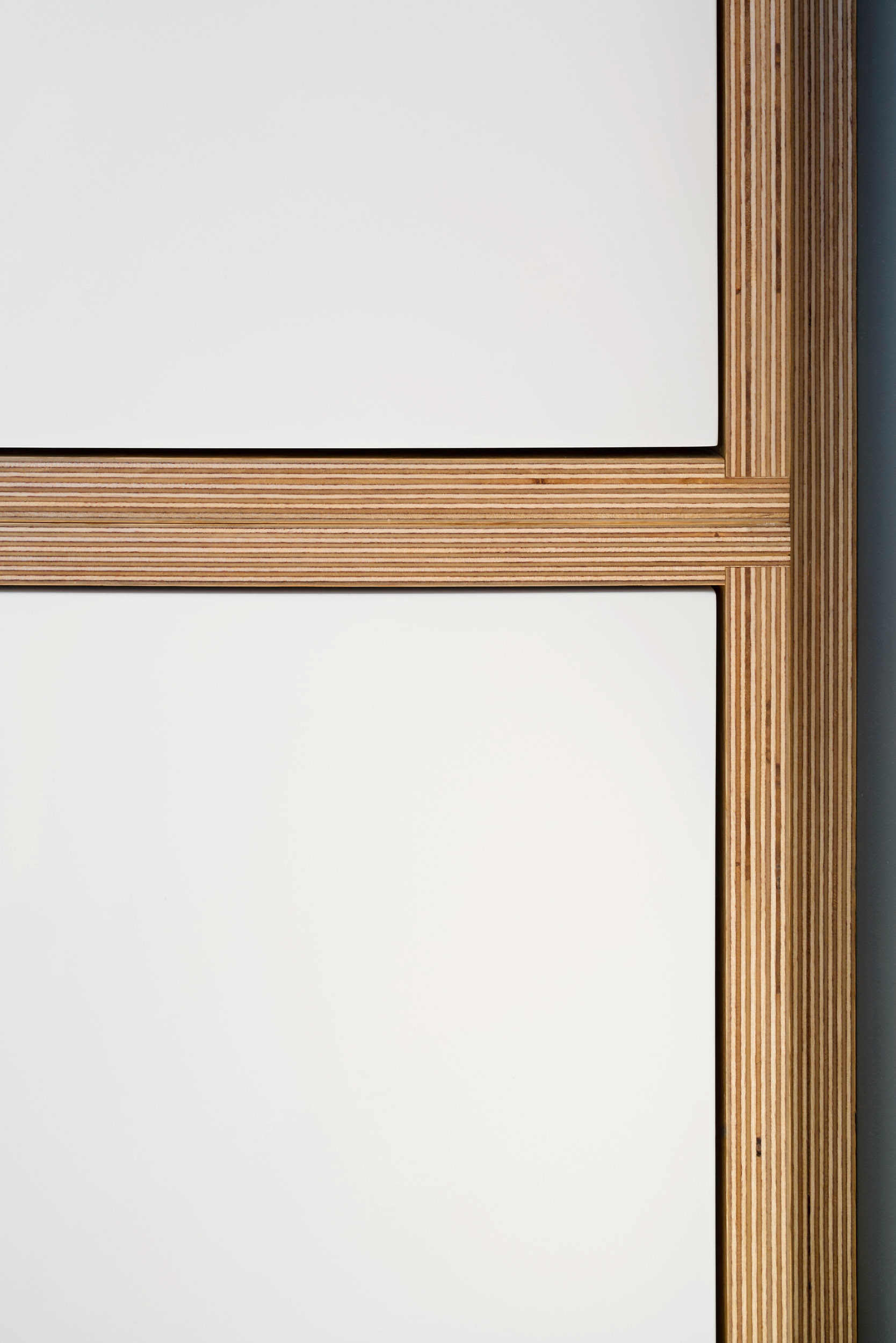 in-frame drawer and cupboard details of ply wardrobe.