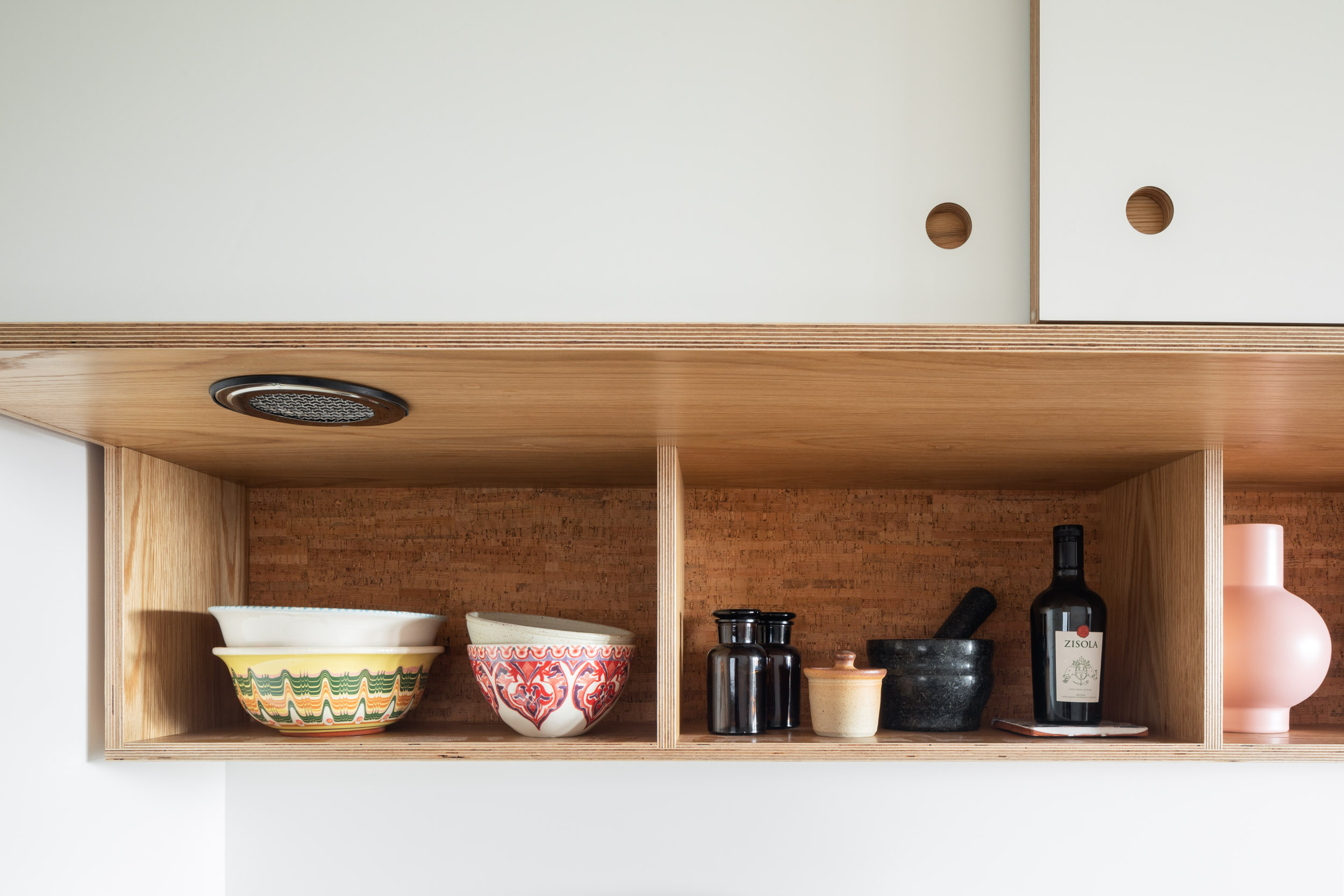 Bespoke plywood overhead cabinet with integrated extractoin