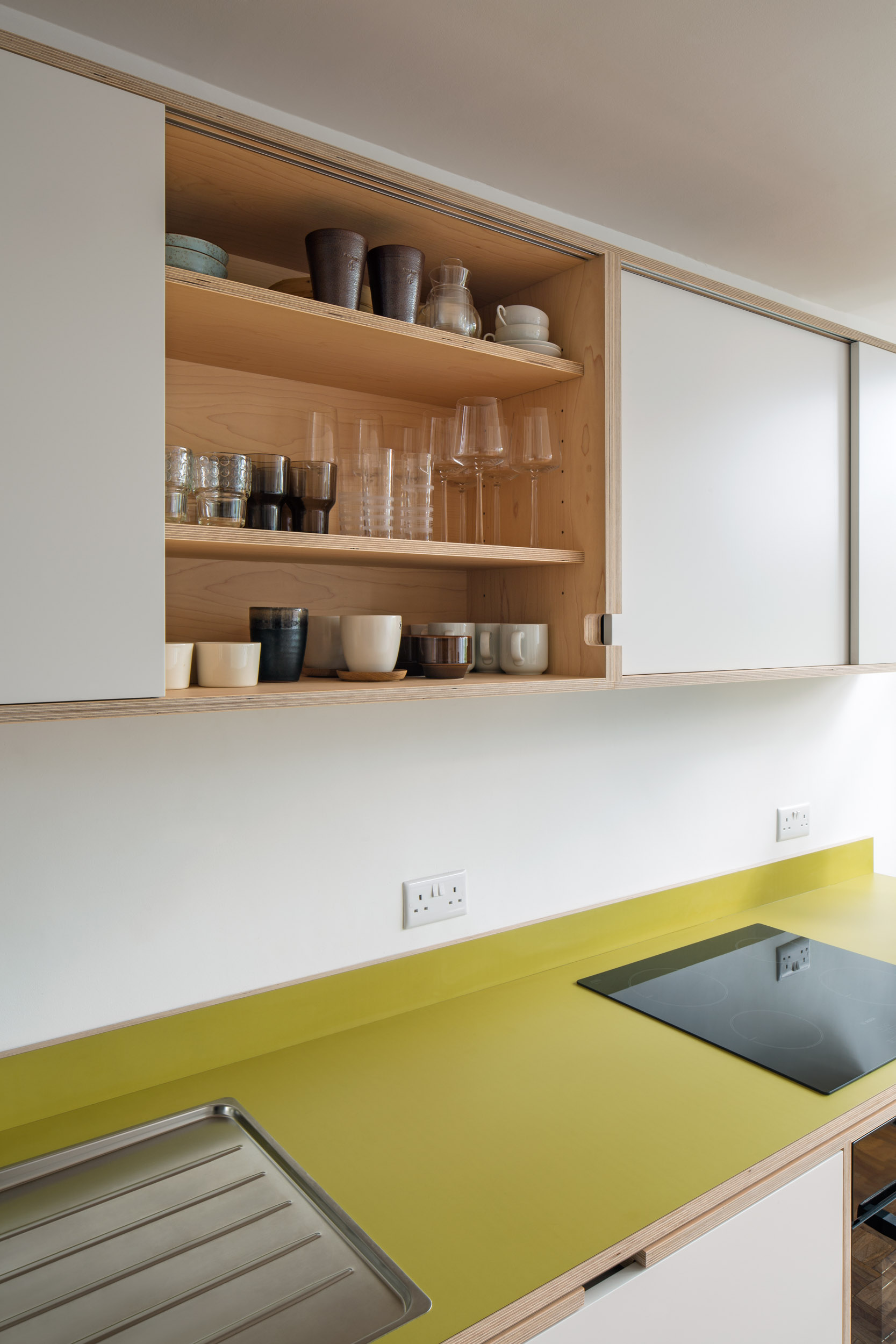 Plywood kitchen with green worktop