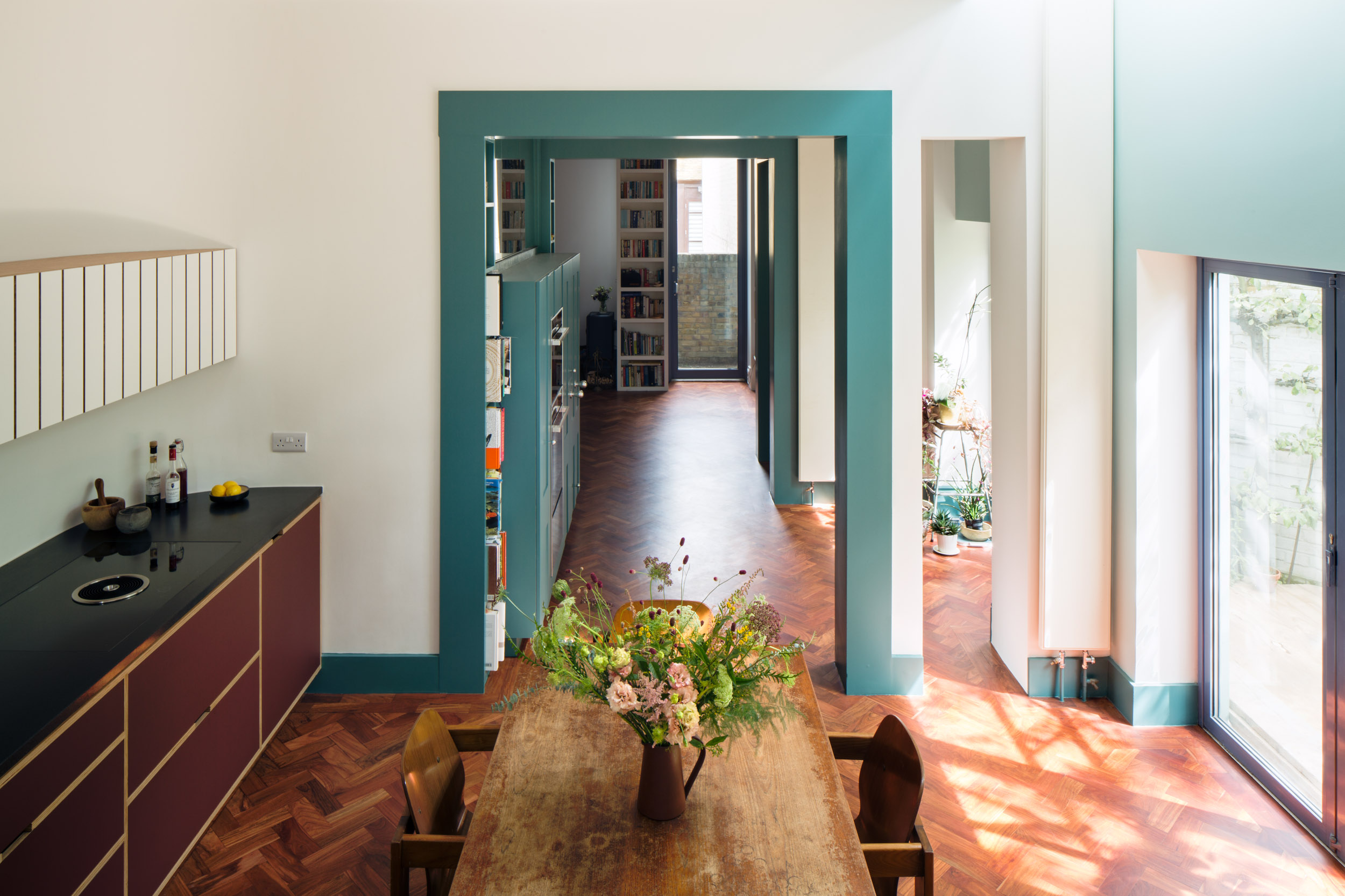 Looking down onto a plywood kitchen and dining table