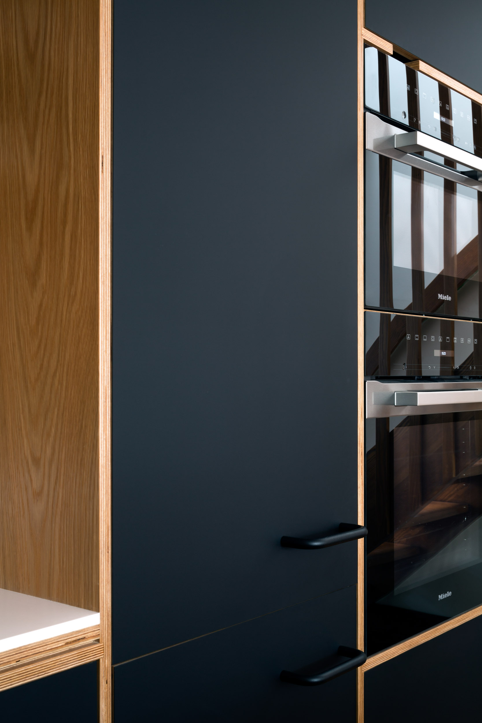 Oak ply cabinet with black doors