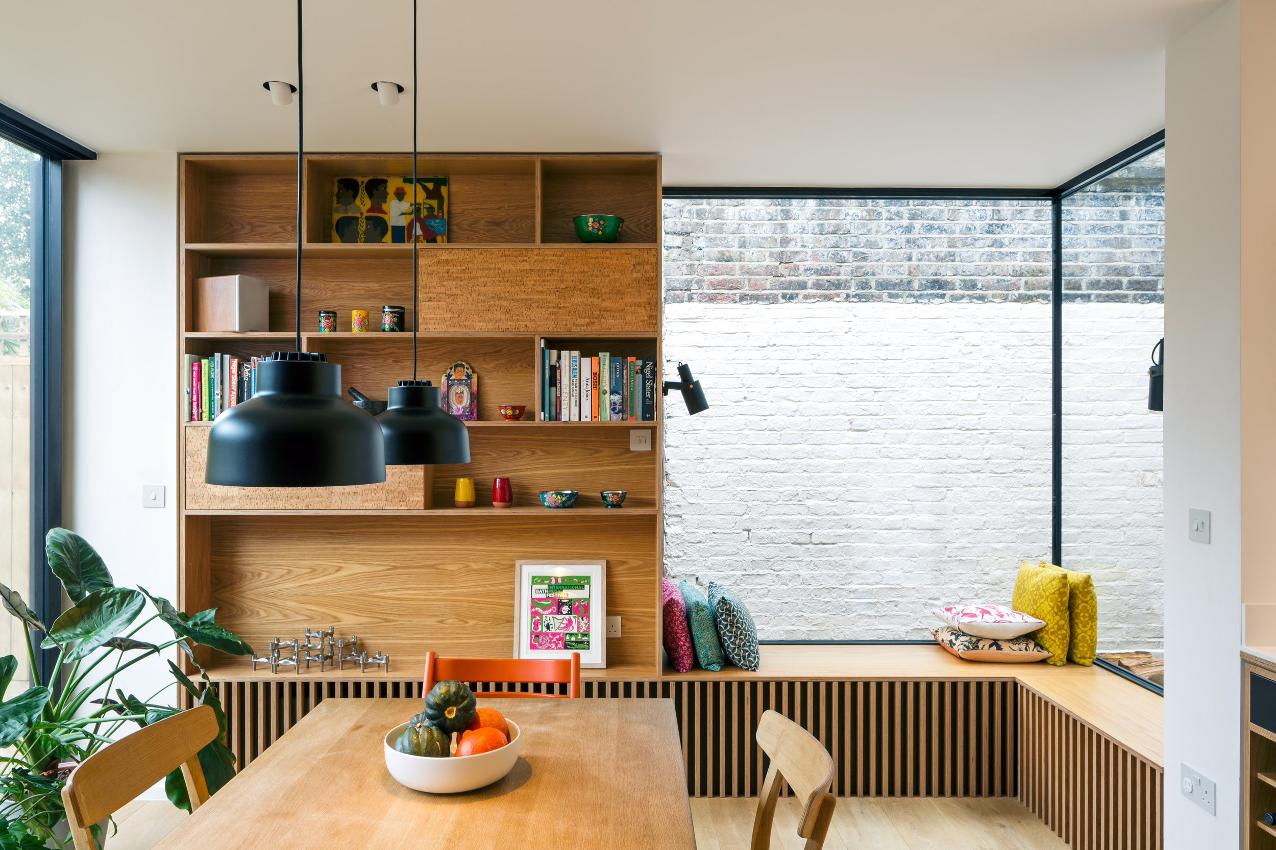 Bespoke ply corner window seat with bookshelves
