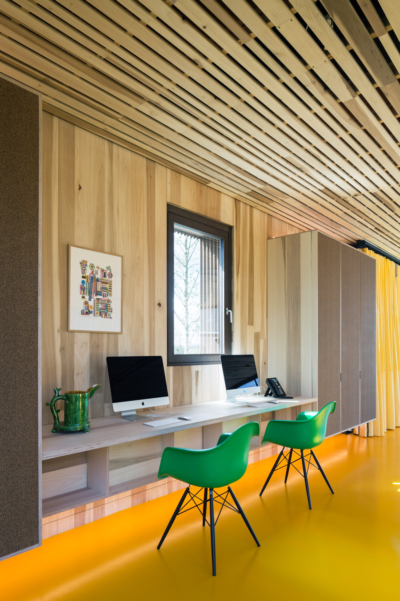 Built-in work station with two green chairs