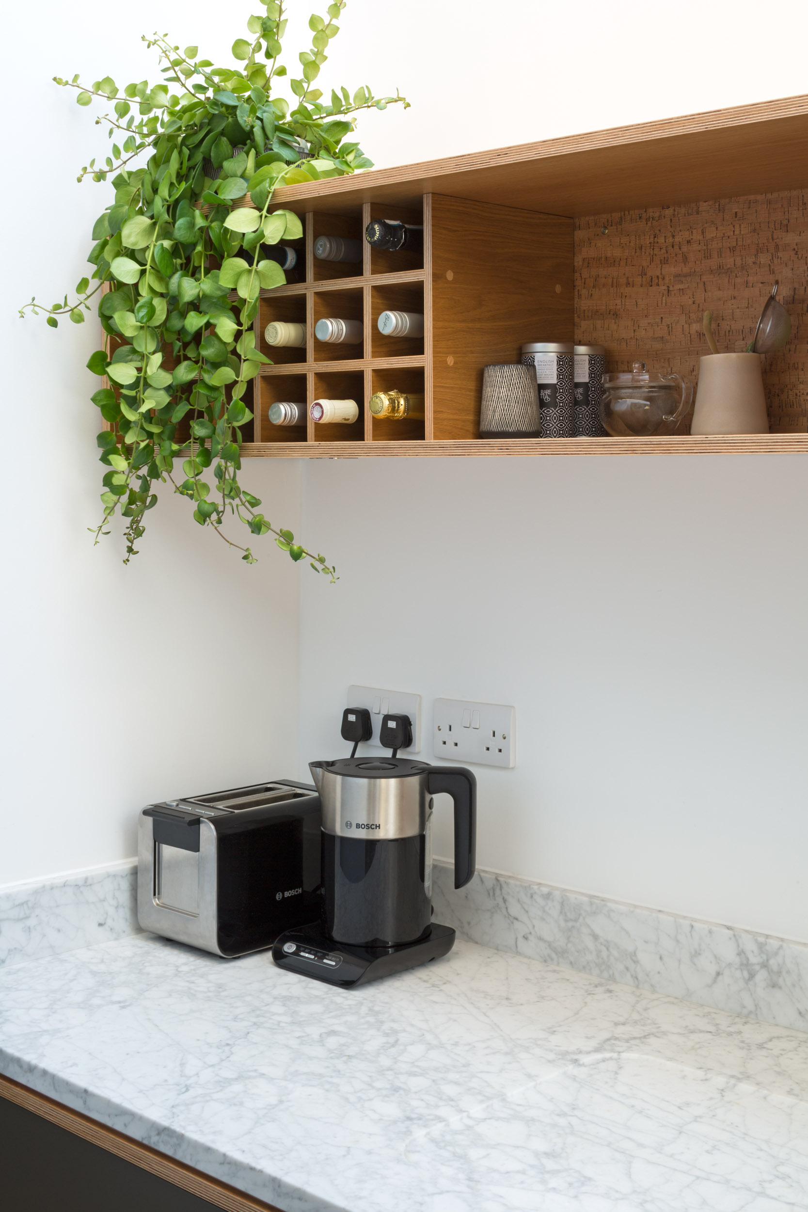Marble Kitchen Worktop With Coffee Machine, winerack and marble worktop detail.
