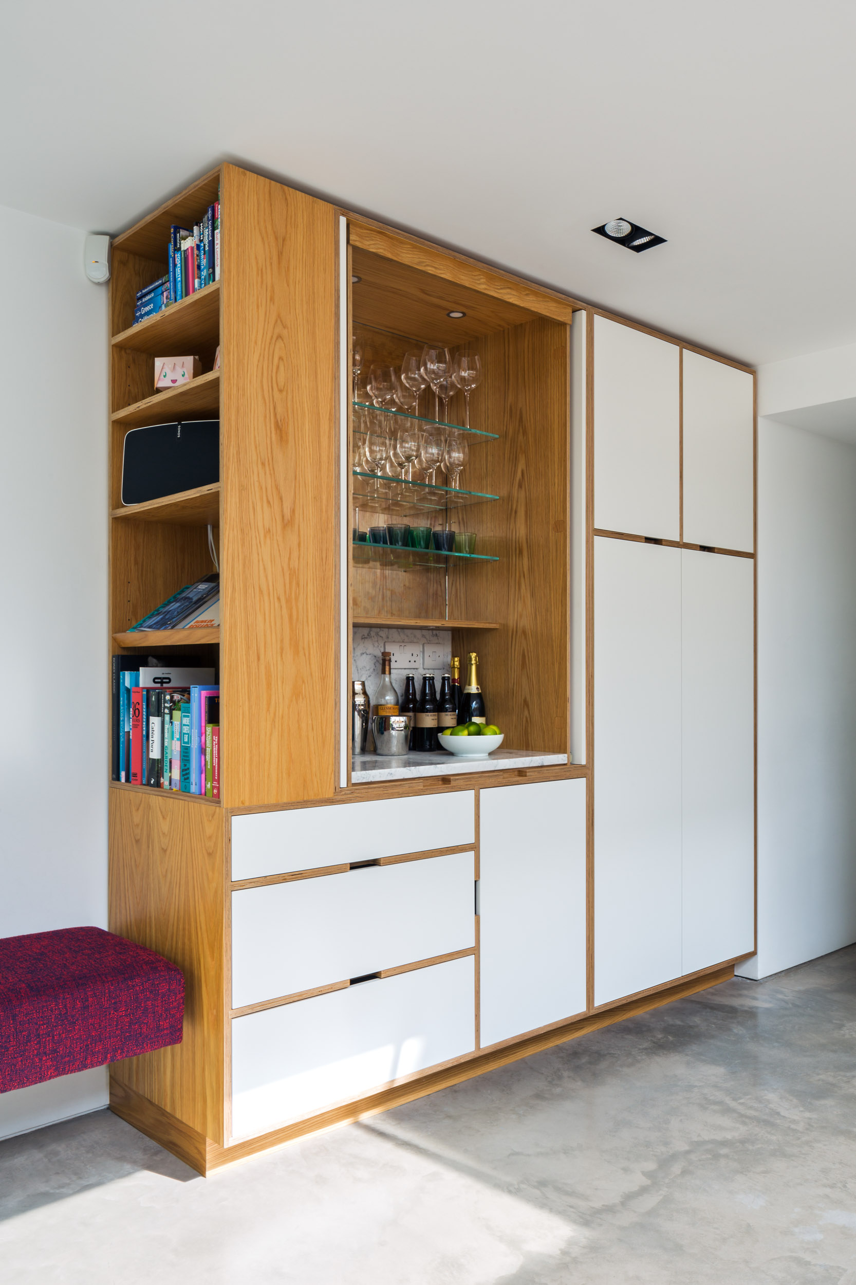 Plywood Kitchen drinks cabinet with mirror backing and bench seating