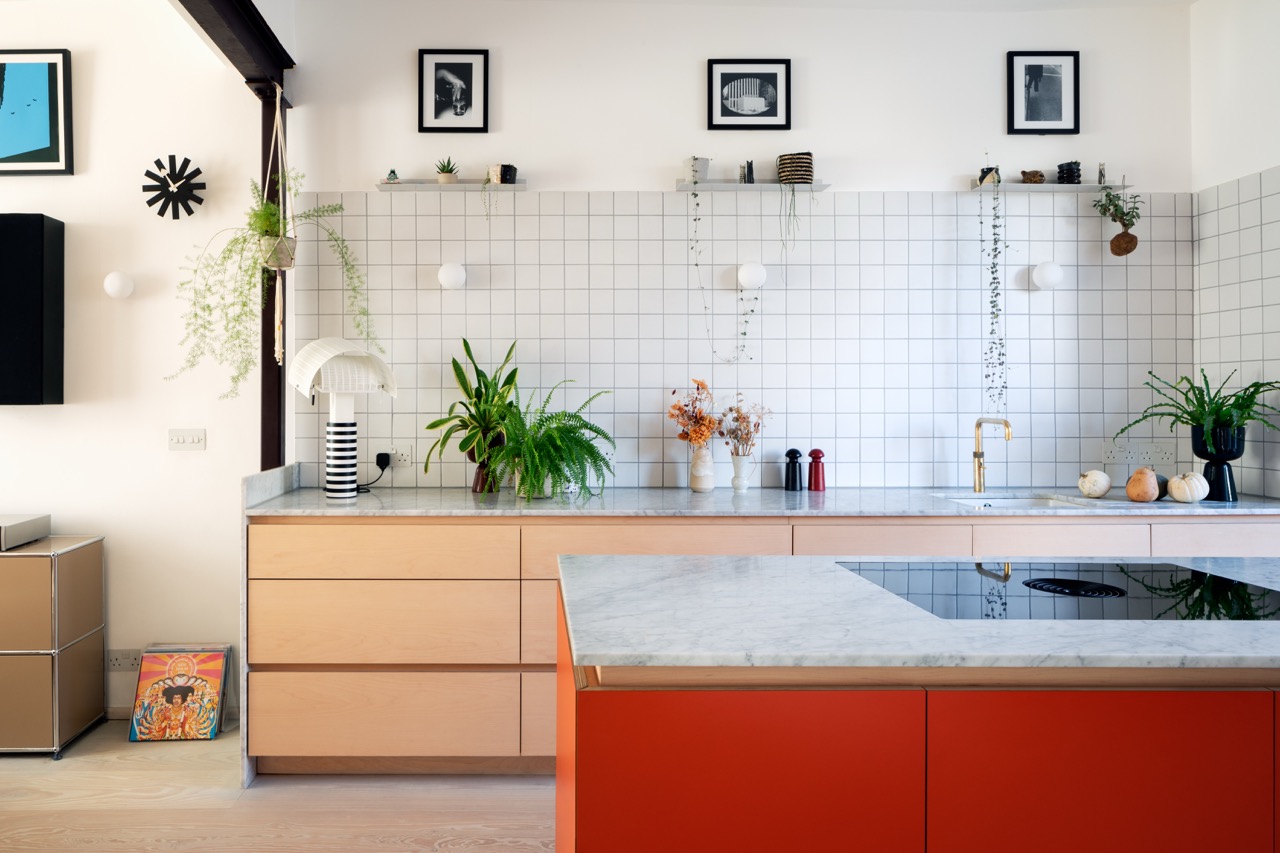 Maple veneer kitchen island with marble worktop and induction hob, bespoke plywood kitchen Hackney by Uncommon Projects