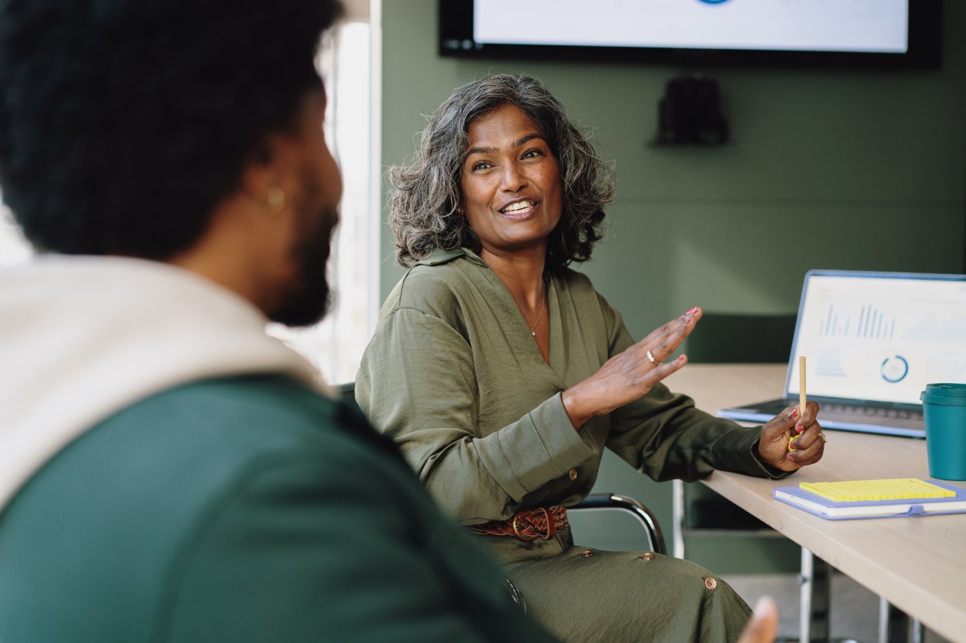 Twin care team member talking with an employer benefits leader