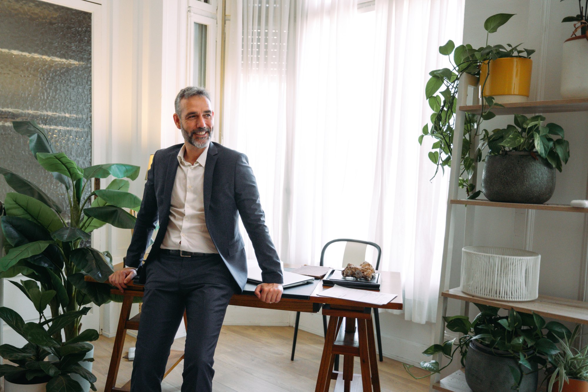 Employer leader smiling in a bright office