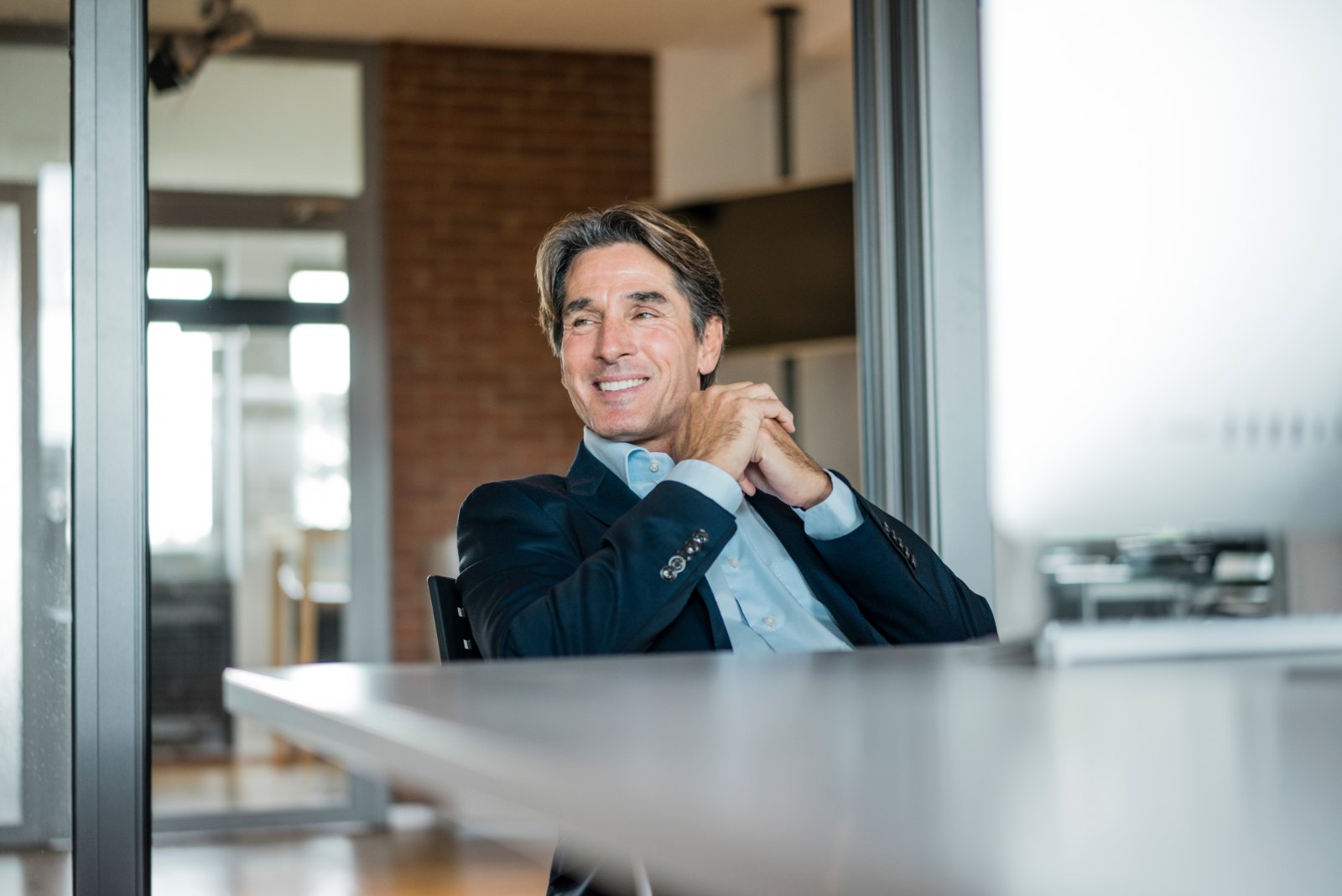 Employer leader smiling in a meeting room