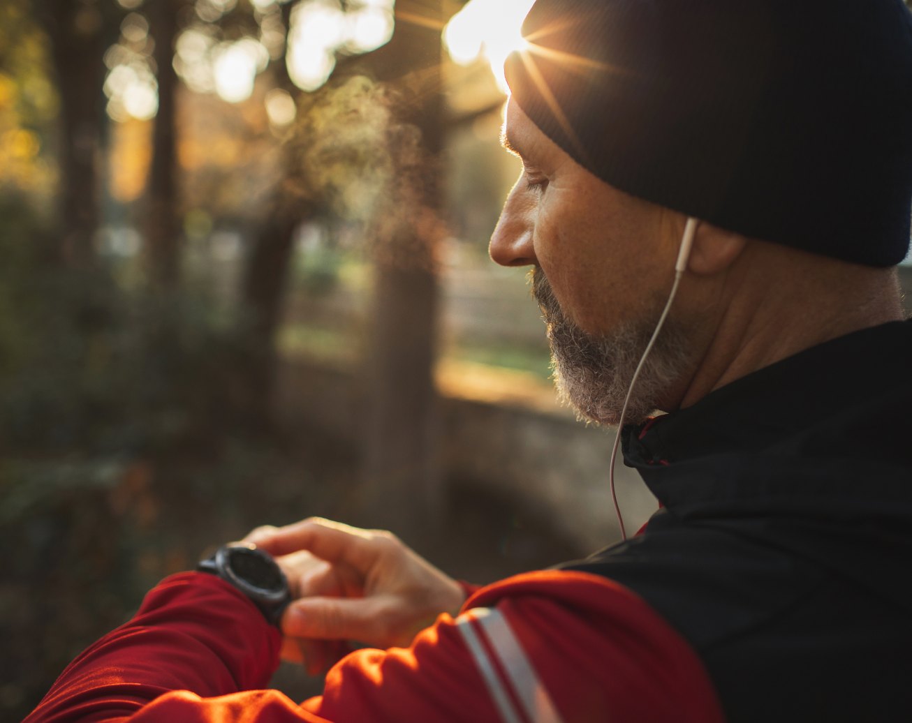 Union member checking his smartwatch on an early morning run