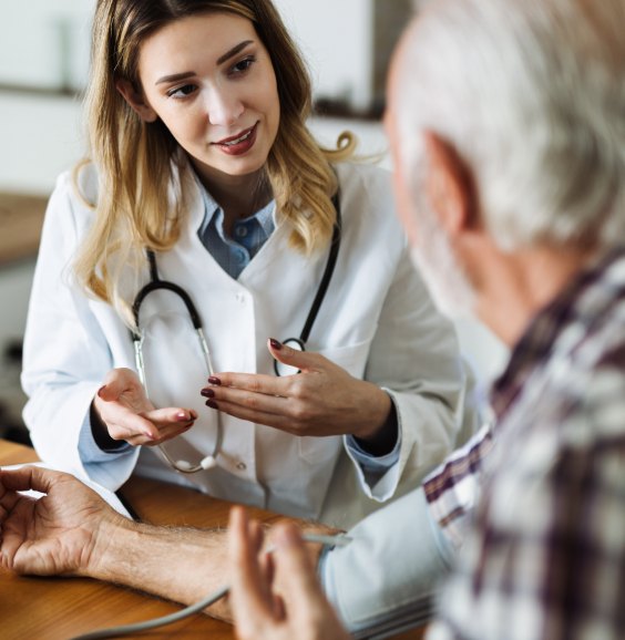 Clinician reviewing results with an older patient
