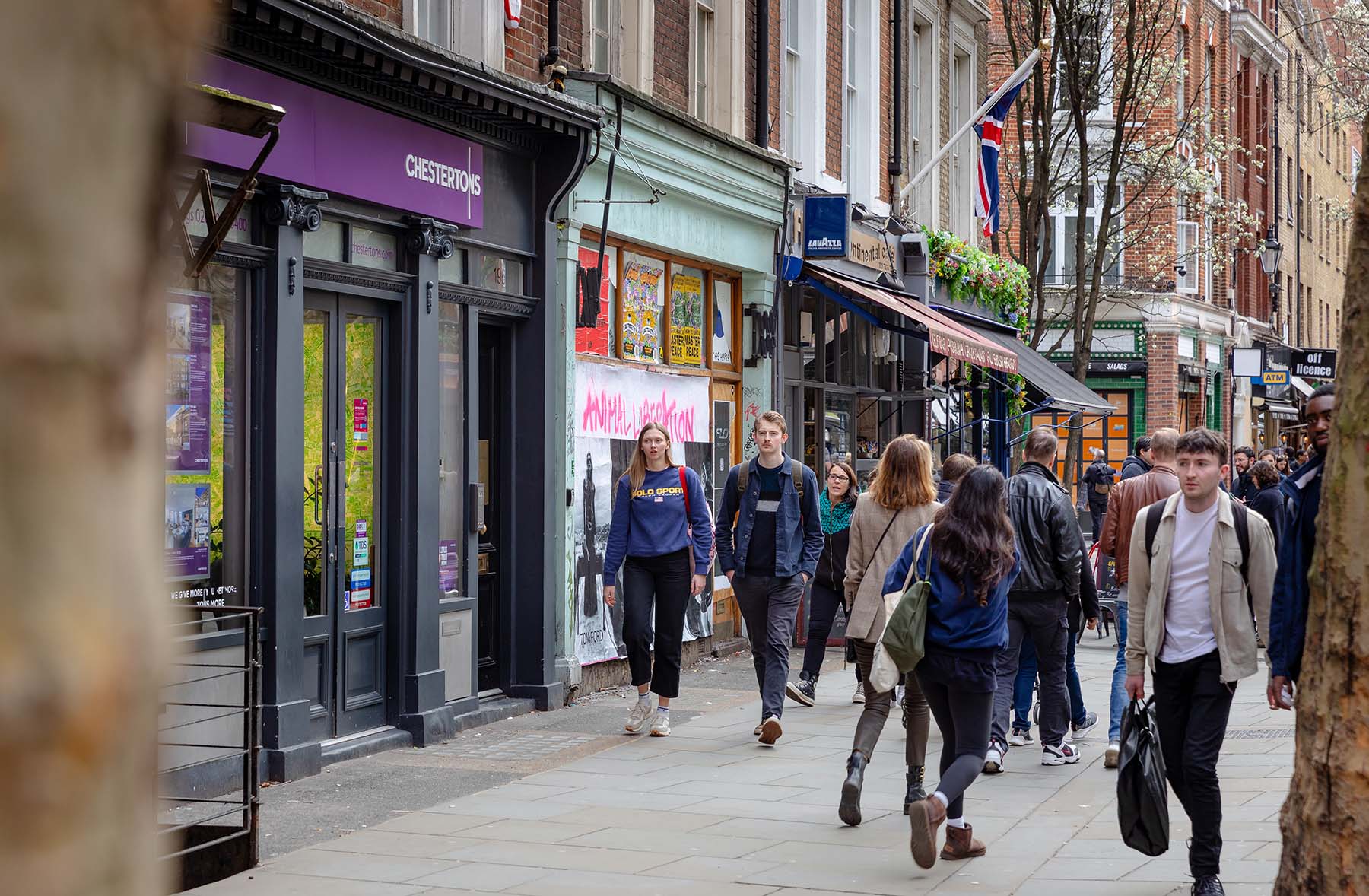 People walking down Shaftesbury Avenue. 